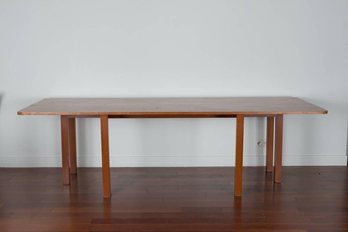 This rare table in wood has a folding tabletop. It can be used as a console (250 cm x 40 cm) or as a dining table (250 cm x 100 cm). Designed by Alvaro Siza for the Boa Nova Tea House in Portugal, the table made of wood is in perfect condition. The