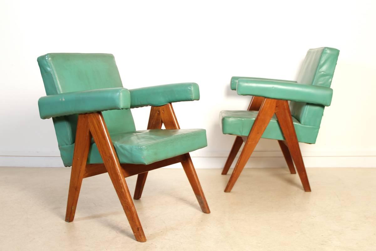 Pair of Chandigarh Committee armchairs. This set of two chairs designed and produced by Pierre Jeanneret for the city of Chandigarh, India have a structure in teak frame with iconic scissor legs, and are covered with a light green coat. Chandigarh