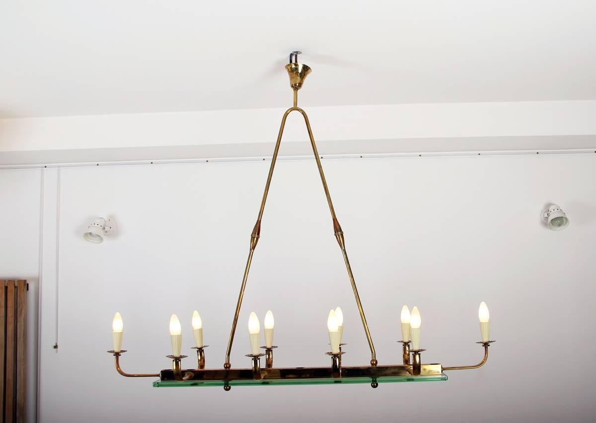 This elegant ceiling lamp from the 1940s is in perfect condition. Brass hardware with a glass plate. Very nice original condition with nicely aged patina on the brass. European plug (up to 250V).