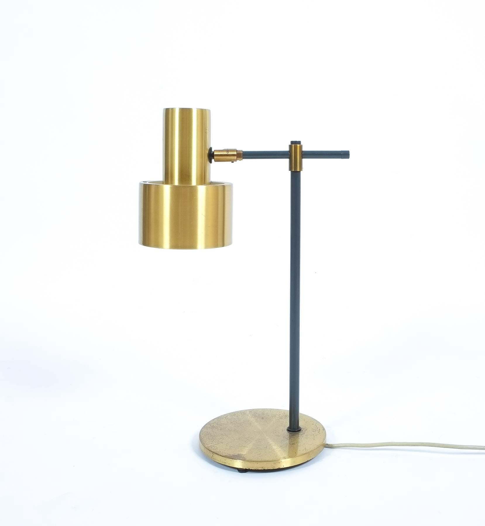 Lento, table lamp designed by Jo Hammerborg for Fog and Mørup in 1967, very rare brass desk light in very good vintage condition! A Classic Mid-Century table lamp with adjustable brass shade with white inner coating, dark gray lacquered metal arm