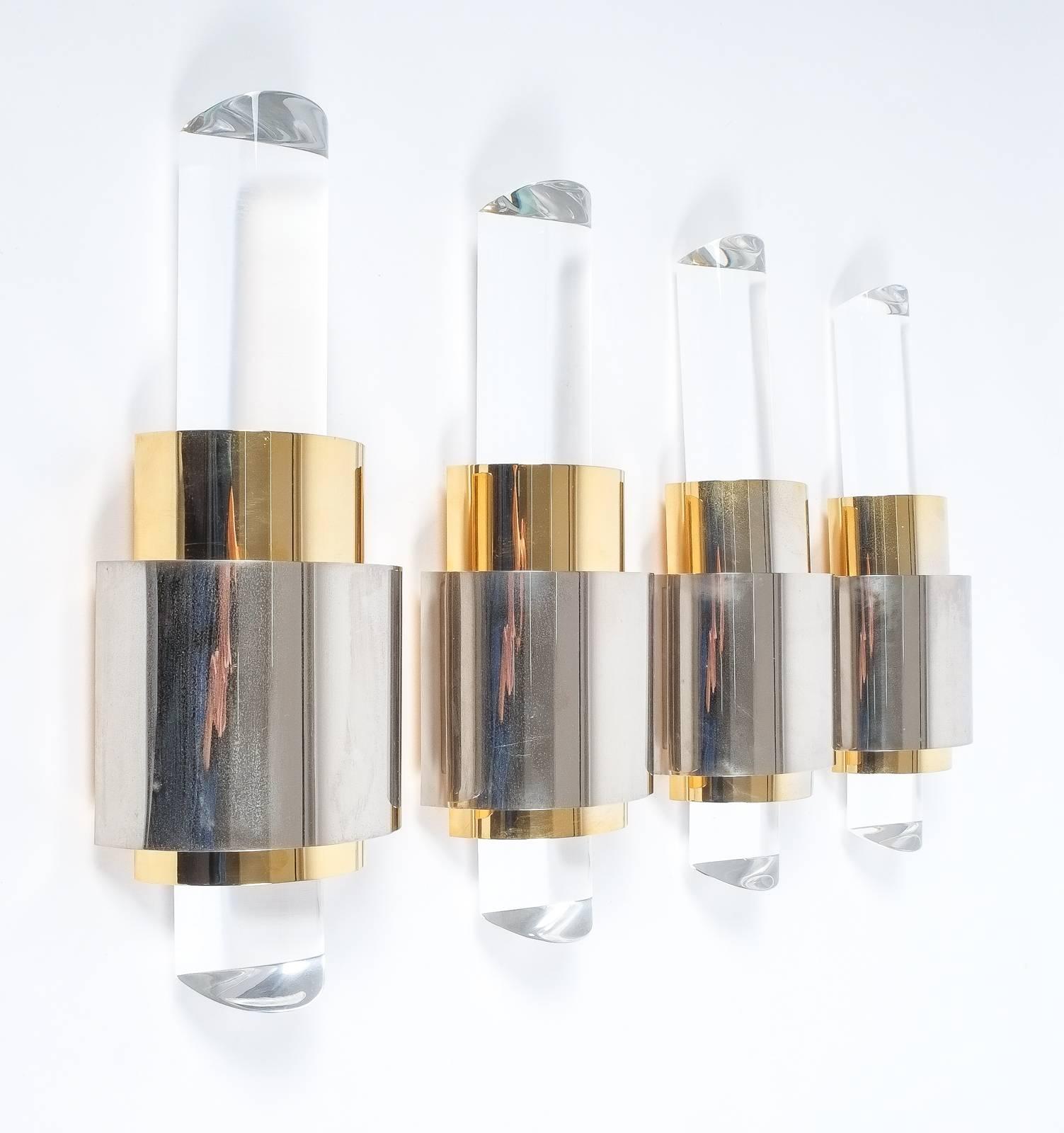 Beautiful set of four identical Lucite wall lights or sconces, France, circa 1980.
Measuring 17" in height these lights cast an amazing light and are in very good condition. 100W halogen bulbs are included. You can find more Lucite tables and
