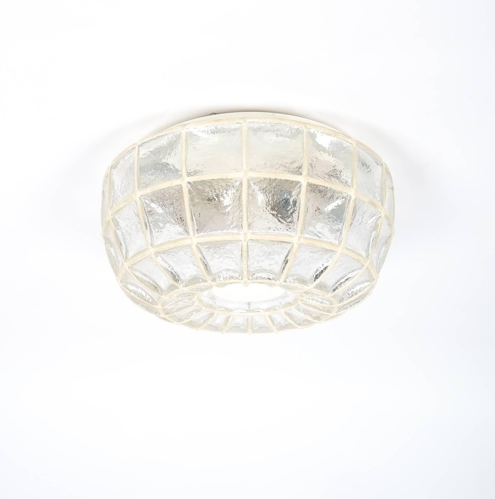 Beautiful 'iron' and glass honeycomb ceiling fixture by Limburg, Germany. This light features a thick clear glass with white grid elements. It holds two large bulbs with 60W each. The condition is excellent, it has been newly rewired (110-220V). We