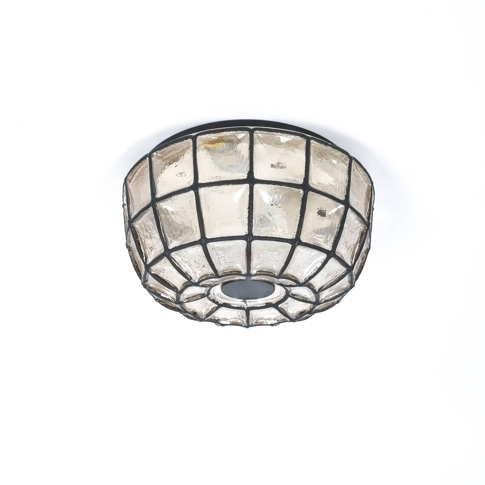 Beautiful 'iron' and glass honeycomb ceiling fixture by Limburg, Germany. This fixture features a thick clear glass with black grid accents. It holds one large bulb with 60W. The condition is excellent, it has been newly rewired (110-220V) 

We have