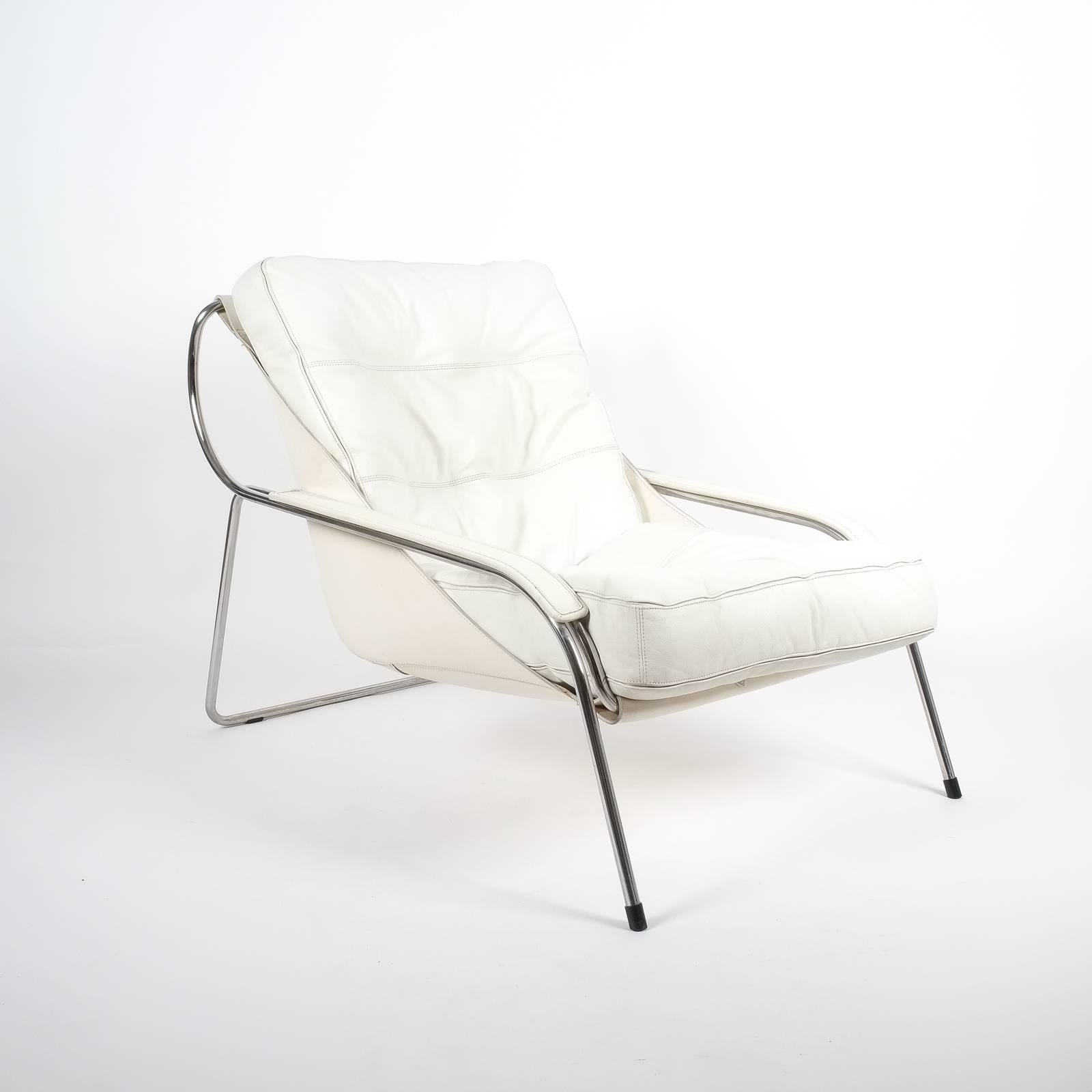Elegant Maggiolina chair by Zanotta designed by Marco Zanuso, originally designed in 1947. Cowhide sling supports one large Nappa leather cushion. A stainless steel frame supports this very comfortable and sleek lounge chair. The condition is very