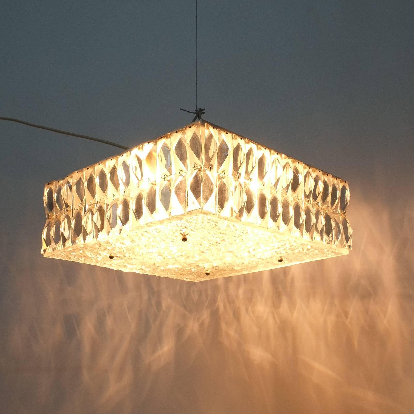 Exquisite ceiling fixture by J.T Kalmar, Austria, 1960 composed of thick textured glass, cut baguette crystals and nickeled brass accents. The light holds 8 bulbs in total (small e14) Max wattage per bulb is 40W. It's in excellent refurbished