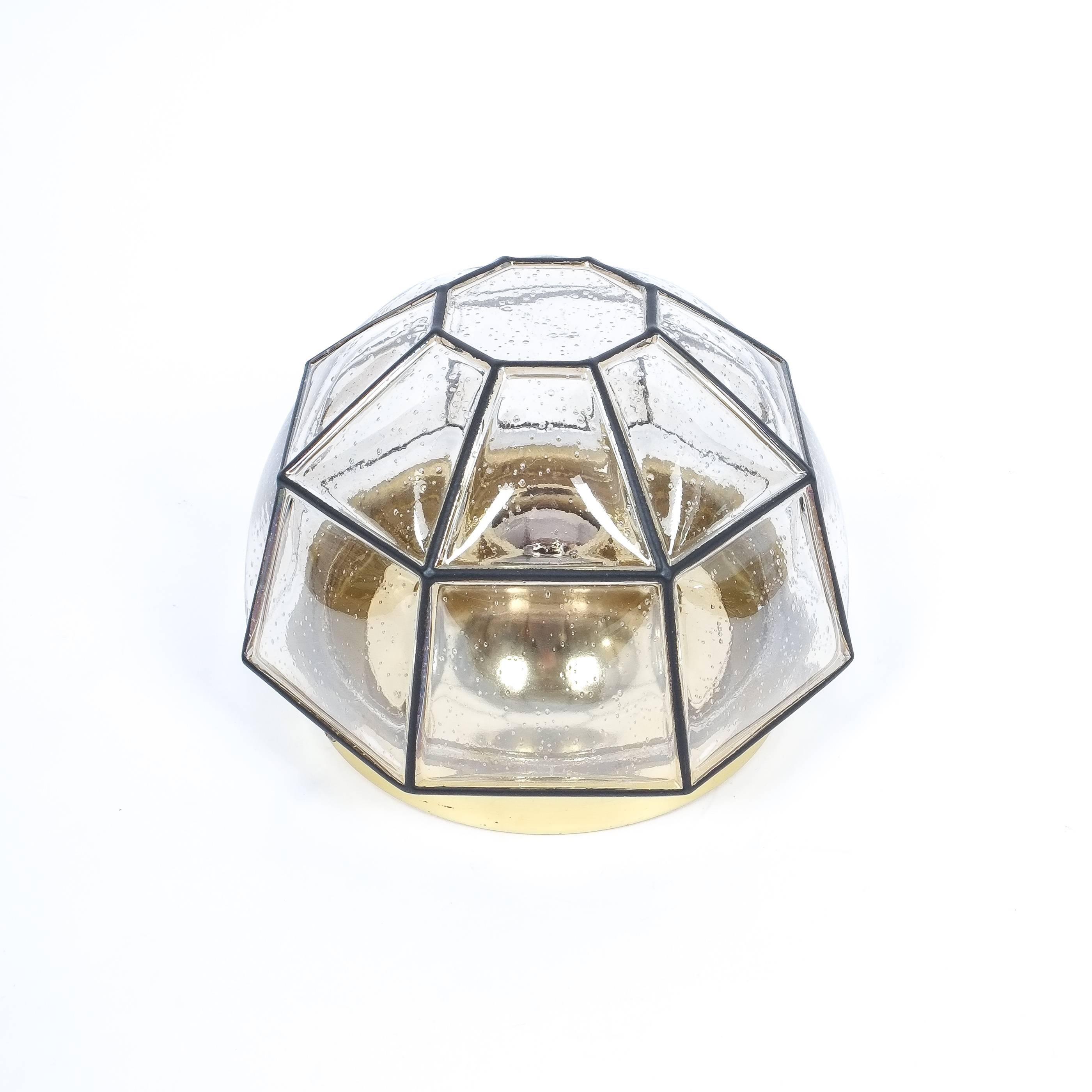 Pair of beautifully shaped clear glass flush mounts by Limburg, Germany. Polygonal shaped flush mounts with black grid accents and brass hardware., newly rewired (110-220V) , a single bulb 75W max. per lamp. Priced as a pair. Please scroll down to
