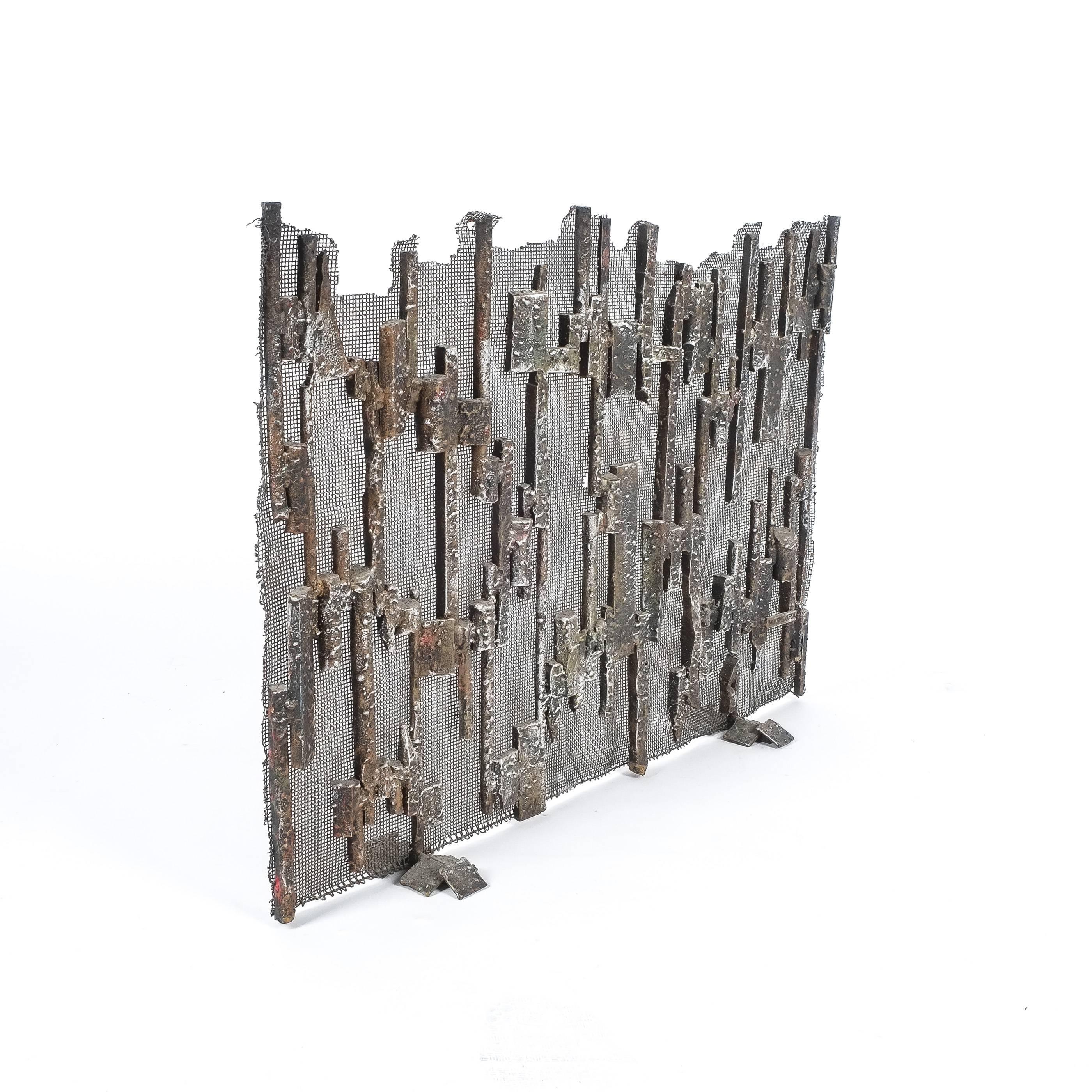 Unique handcrafted firescreen by Salvino Marsura, Italy, 1960. Artistic sculptural fire screen with a dense metal mesh welded to an ornamental iron structure.