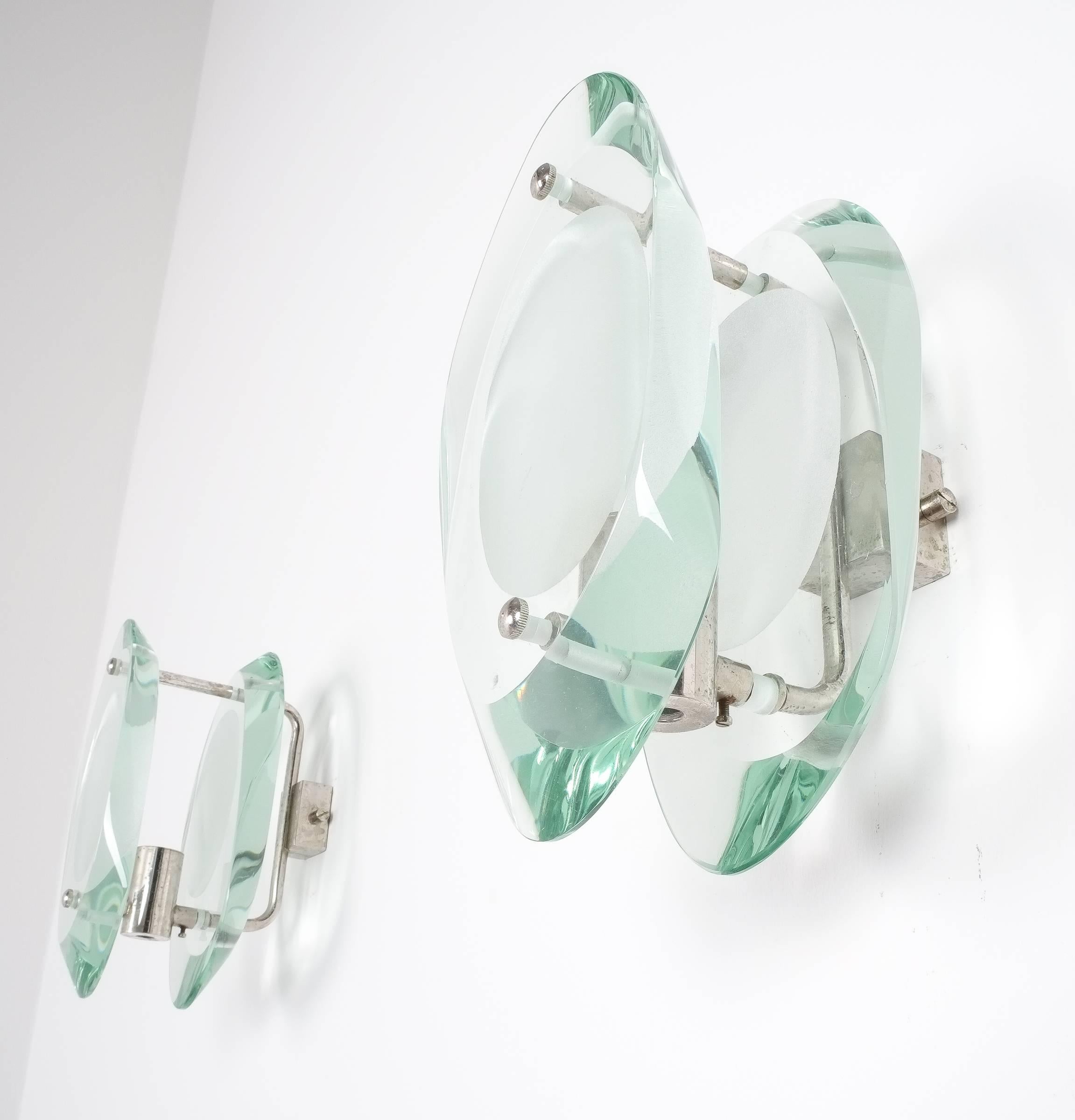 Max Ingrand for Fontana Arte glass sconces wall lamps set of four, Italy, 1960. Double lens cut panels of thick profiled polished glass with etched glass centers. Nickel-plated metal mounts. Newly rewired and refurbished, excellent condition. We