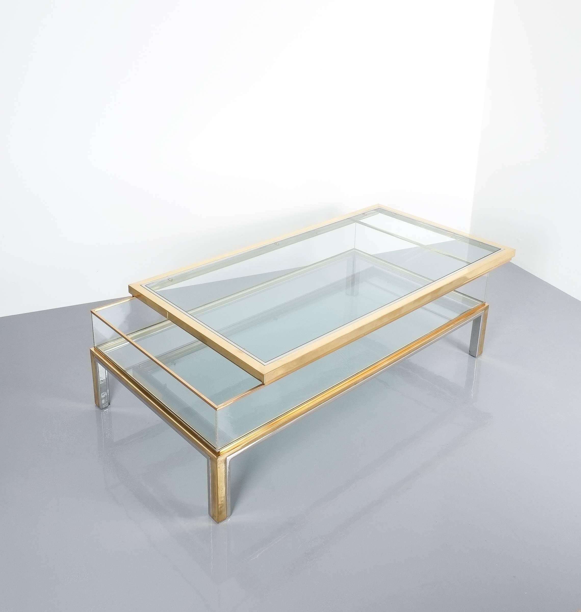 Maison Jansen sliding glass and brass chrome vitrine coffee table, France, 1970. Beautiful rectangular compartment table (51 x 27