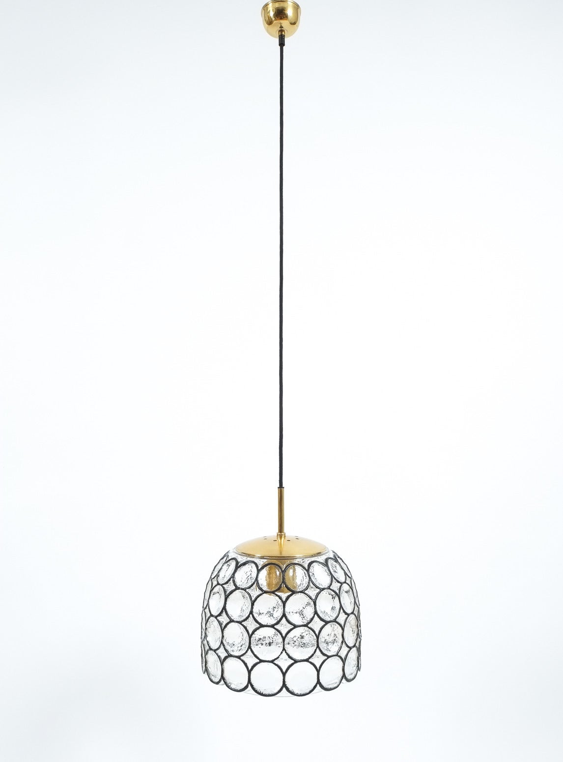 Beautiful pair of 'iron' and glass bell-shaped pendants by Limburg, Germany. The fixtures feature a concave thick clear glass shade with circle 'iron' elements. The hardware is made from brass, holding a single large bulb (100W max). The condition