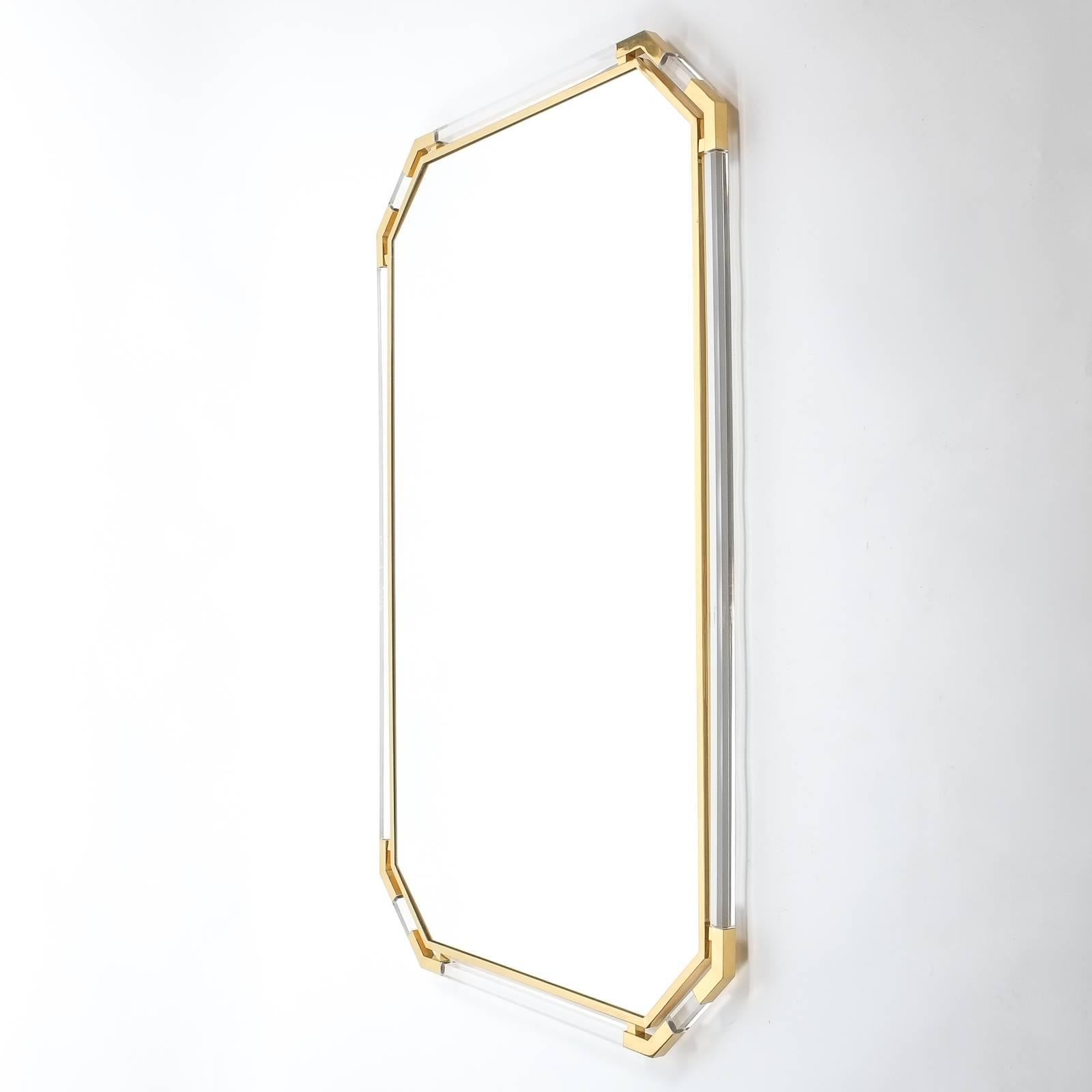 Magnificent 63 inch mirror by Guy Lefevre for Maison Jansen, Paris, 1970.
Beautiful double frame mirror with Lucite and brass construction. Heavy quality piece in great condition with hardly any wear to the frame. The mirror can either be hung up