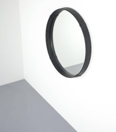 Specchio circolare avvolto in pelle di Pace