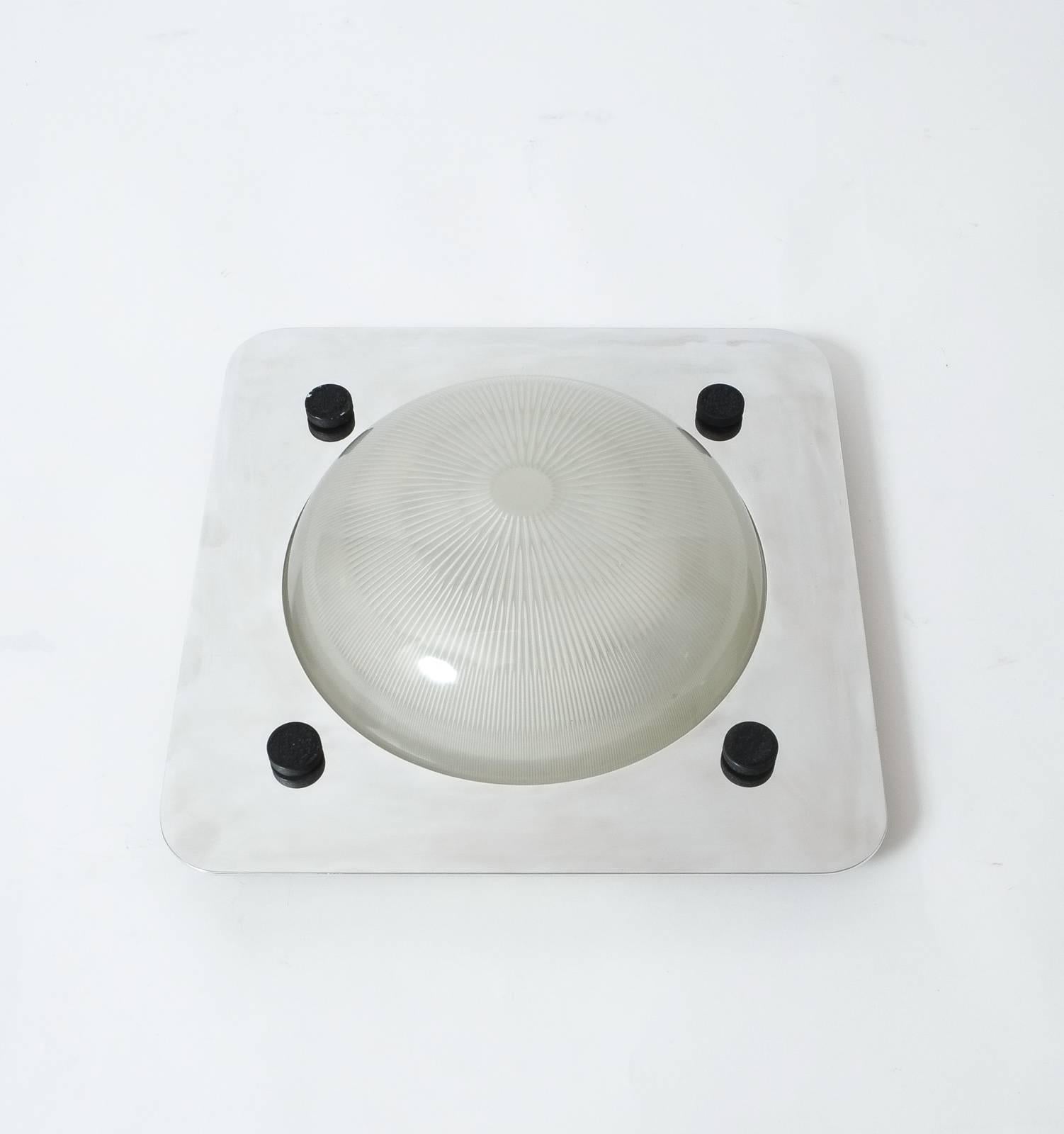 Very elegant ceiling fixture or wall light designed by Sergio Mazza for Artemide. 
We have two available in different sizes. White enameled metal base in with a mounted polished metal frame and glass dome. The condition is excellent vintage, newly