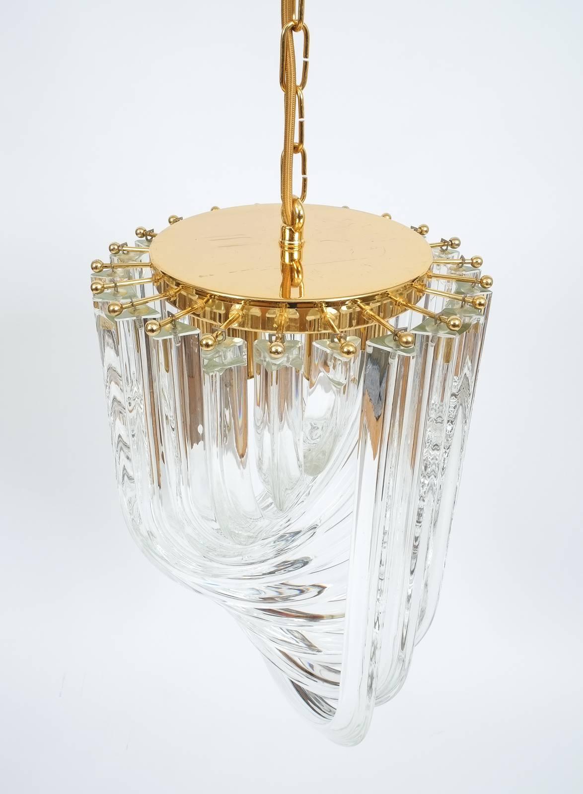 One of Three Venini Curved Crystal Glass Gilt Brass Chandelier, priced per piece, discount available for multiple purchase

Pristine Triete crystal glass chandelier with interlocking bended triete crystal rods in helix formation. We have a total of