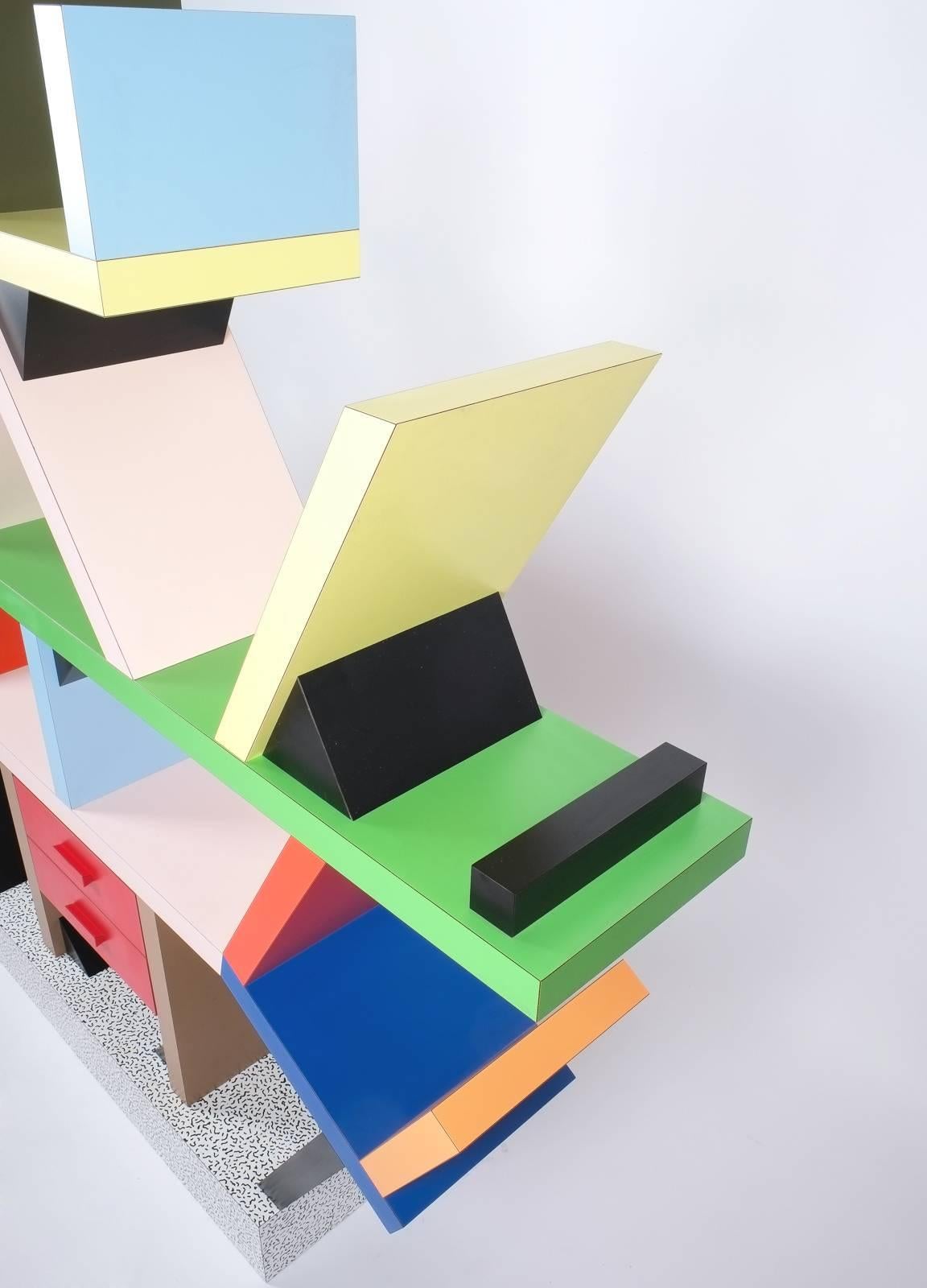 Colorful iconic 'Carlton' bookcase or room-divider designed by Ettore Sottsass for Memphis Milano in 1981. Heavy quality HPL (high pressure laminate) on wood construction in various colours. This piece derives from a production manufactured circa