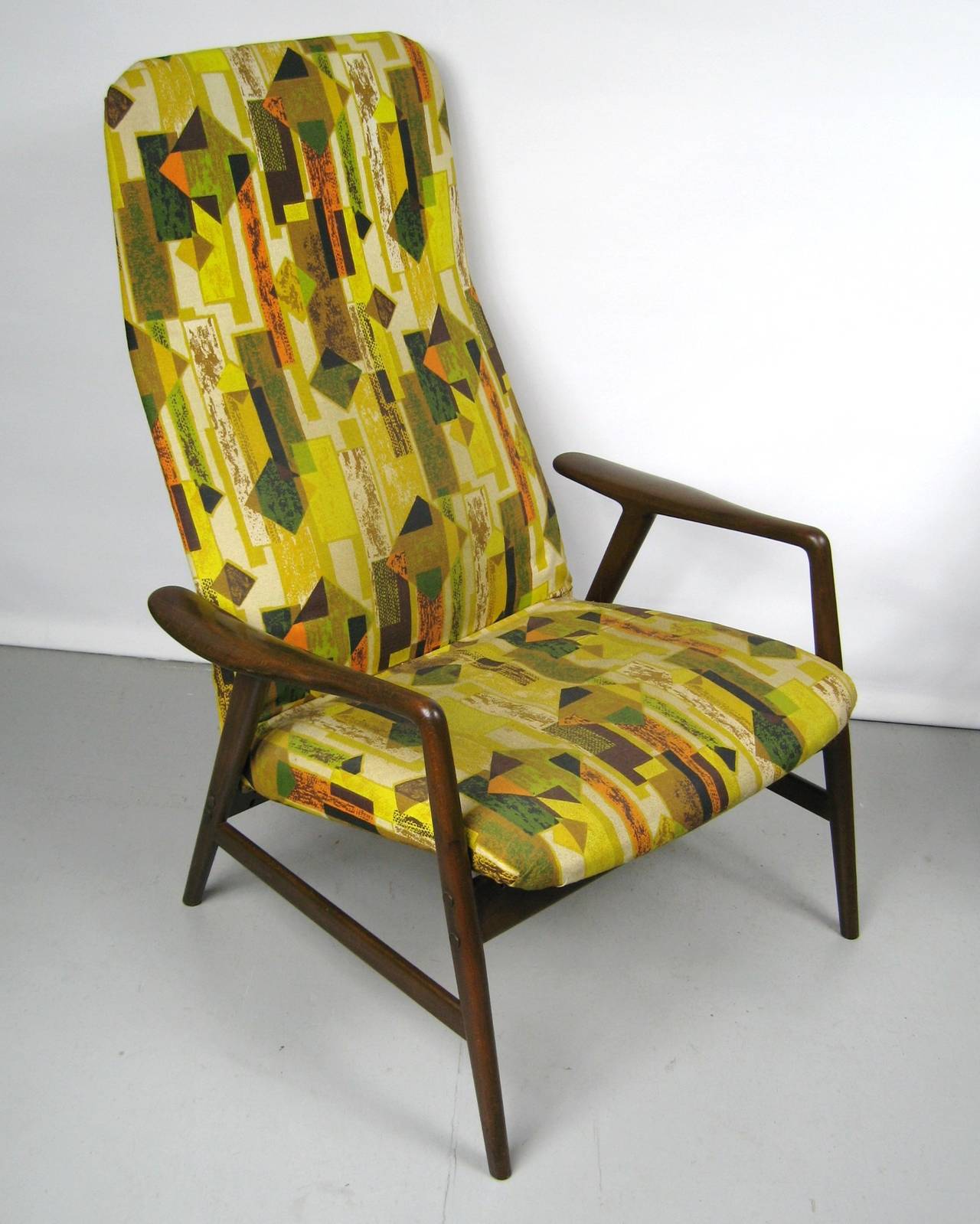 Reclining chair and ottoman by DUX. This may be the original fabric (which is fabulous but may need to be replaced) wood is in great vintage condition with normal wear and slight imperfections. This is a must-have for your Mid-Century Modern abode.