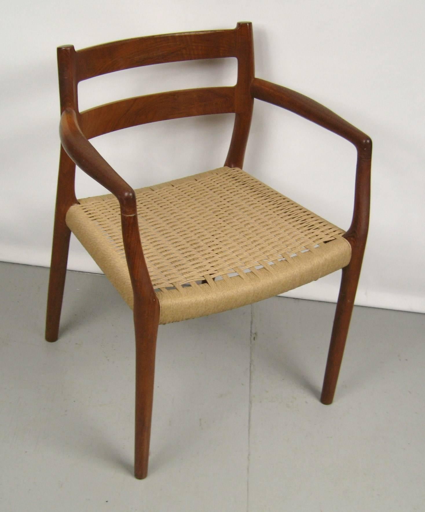 Teak Mid-Century Modern chair by Moller.
Chair and ottoman paper cord seat was just recorded.
Chair measures: 
23 in W x 20 in D x 30 in H
17.5 in up to seat. 
Ottoman:
19.5 in W x 14.75 in D x 17.5 in H. 

Any questions please call or hit