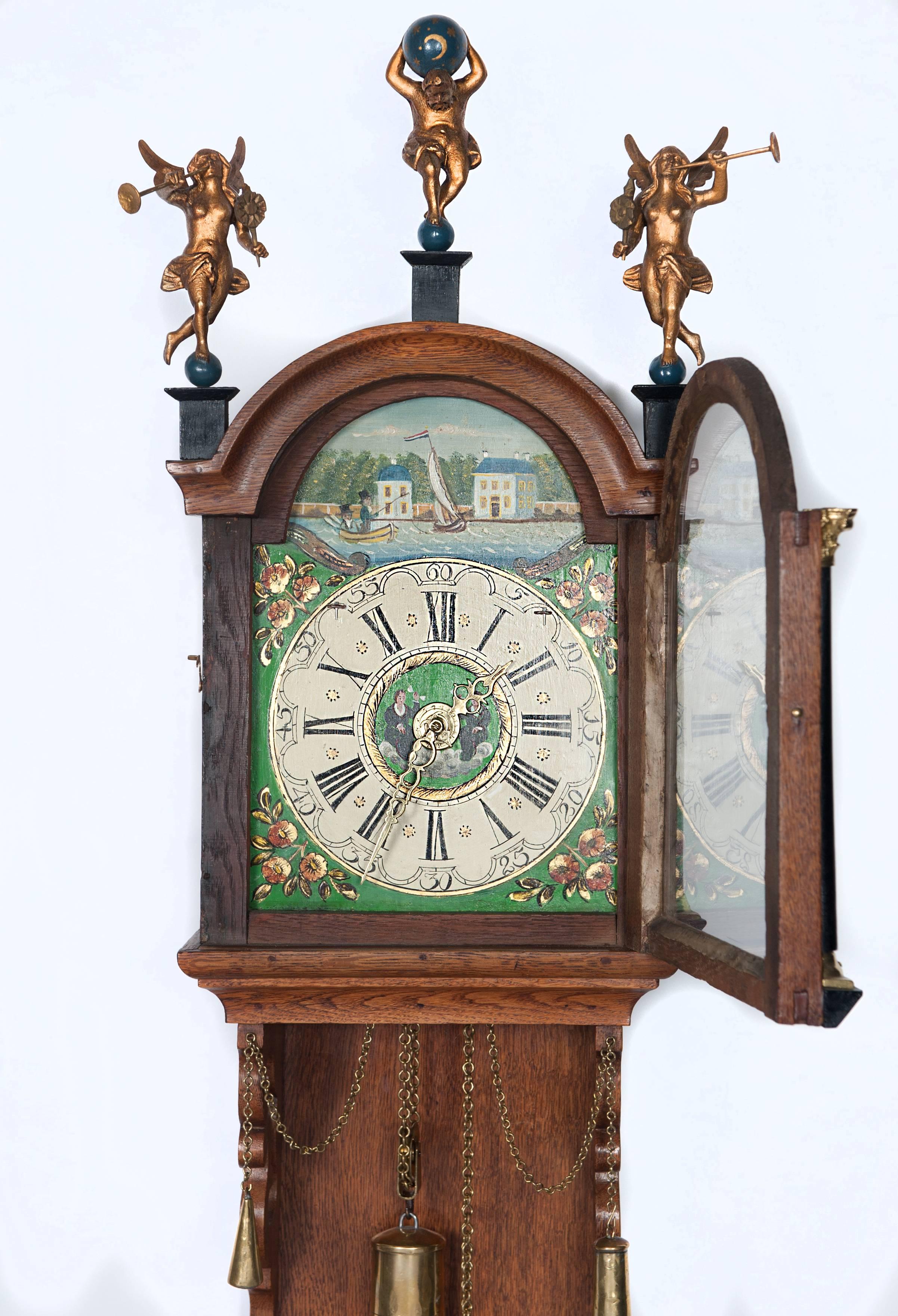 A Dutch miniature Friesland longtail wall clock. Circa 1860.
These small tall clocks were named 