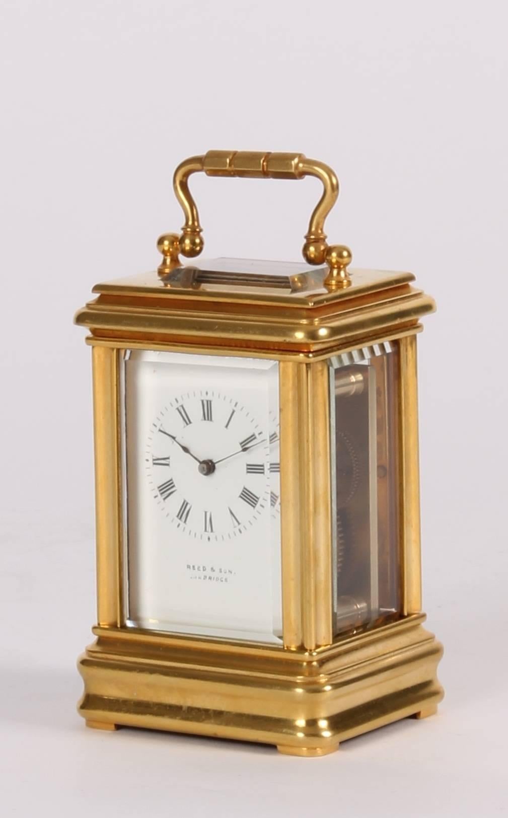 Retailed French miniature gilt brass timepiece, by Reed & Son, circa 1880.

3.5-cm enamel dial with Roman numerals and fine blued hands signed below for the retailer 'Reed & Son Cambridge', 8-day movement with platform cylinder escapement, moulded