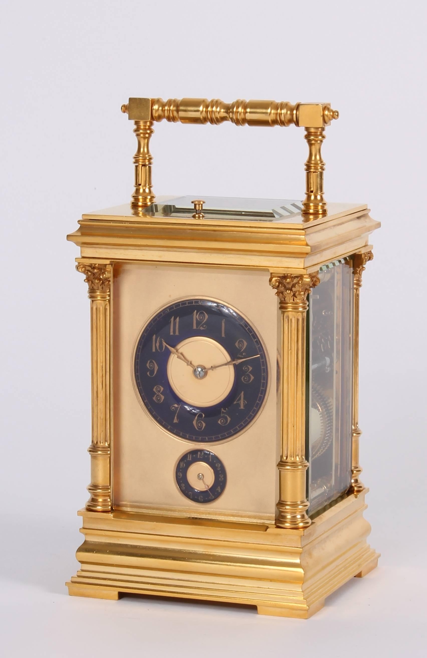 A French gilt brass carriage clock with rare blue enamel dials in Anglaise case, circa 1890.

Blue enamel chapter rings with Arabic numerals for time and alarm below, 8-day spring driven movement with platform lever escapement, trip repeating half