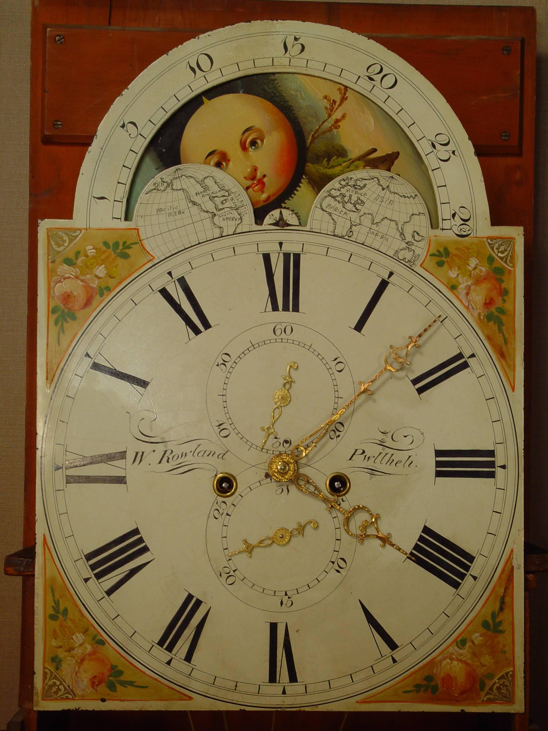 A Welsh mahogany longcase clock with moon phase W. Rowland Pwllheli, circa 1830.
Japanned dial with Roman numerals signed W. Rowland Pwllheli, matching engraved brass hands and subsidiaries for seconds and date, polychrome moon phase in the arch,
