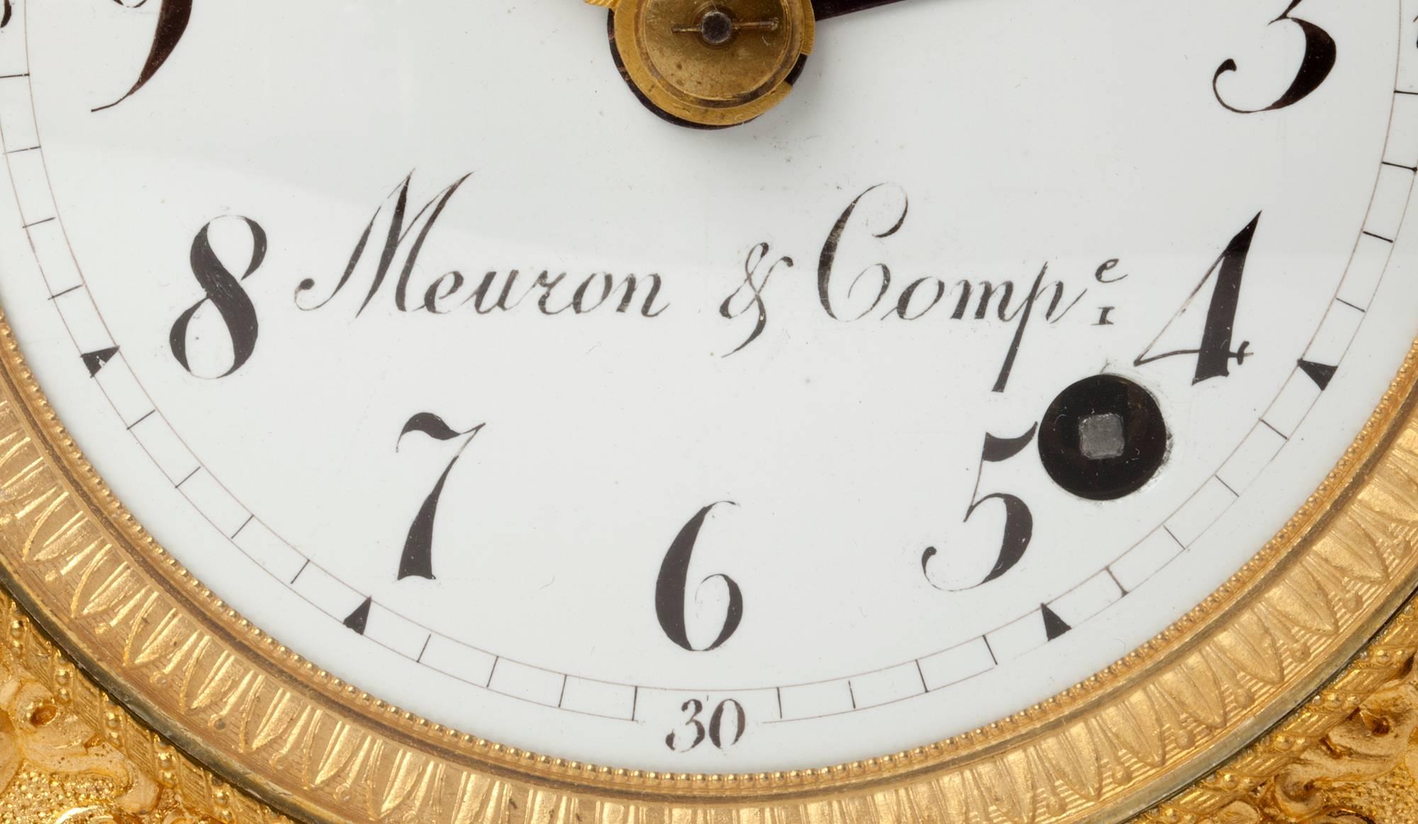 A Swiss ormolu 'pendule d'officier' with grande sonnerie, by Meuron & Compagnie, circa 1810.

9.7 cm enamel dial with Arabic numerals signed Meuron & Comp, fine pierced gilt hands and blued alarm pointer, two day movement with pull repeating