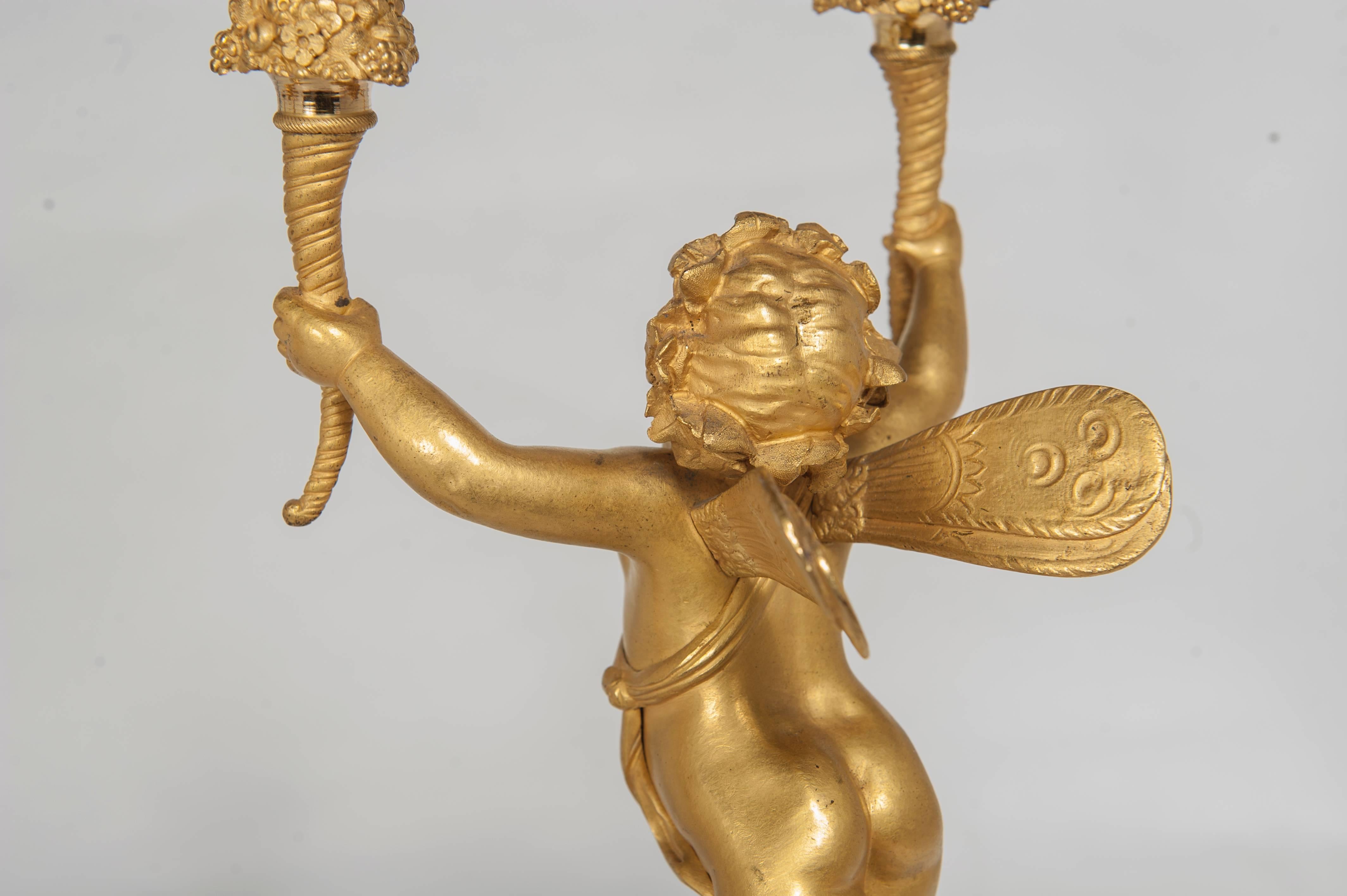 French Pair of Two-Armed Empire Ormolu Candlestick with Cupids, circa 1820 For Sale
