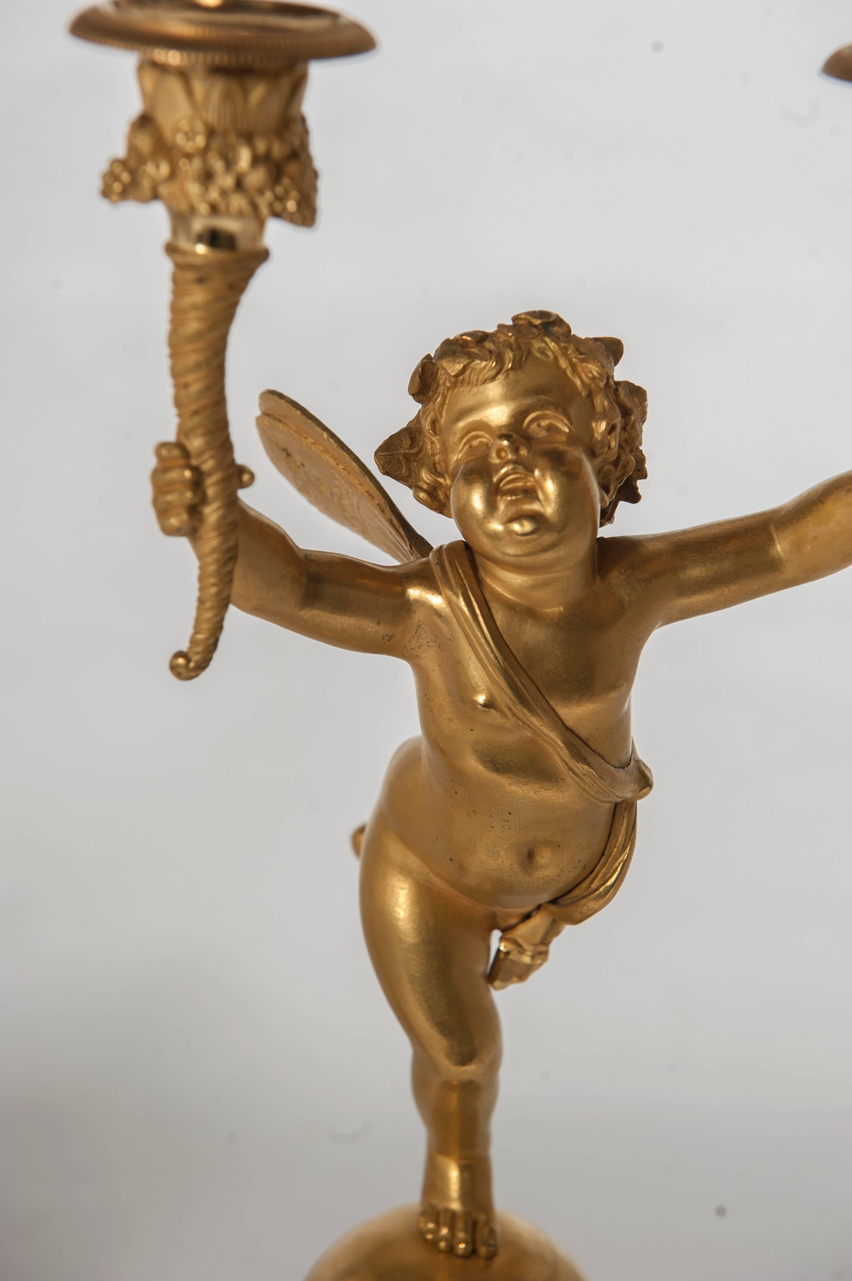 Pair of Two-Armed Empire Ormolu Candlestick with Cupids, circa 1820 In Good Condition For Sale In Amsterdam, Noord Holland