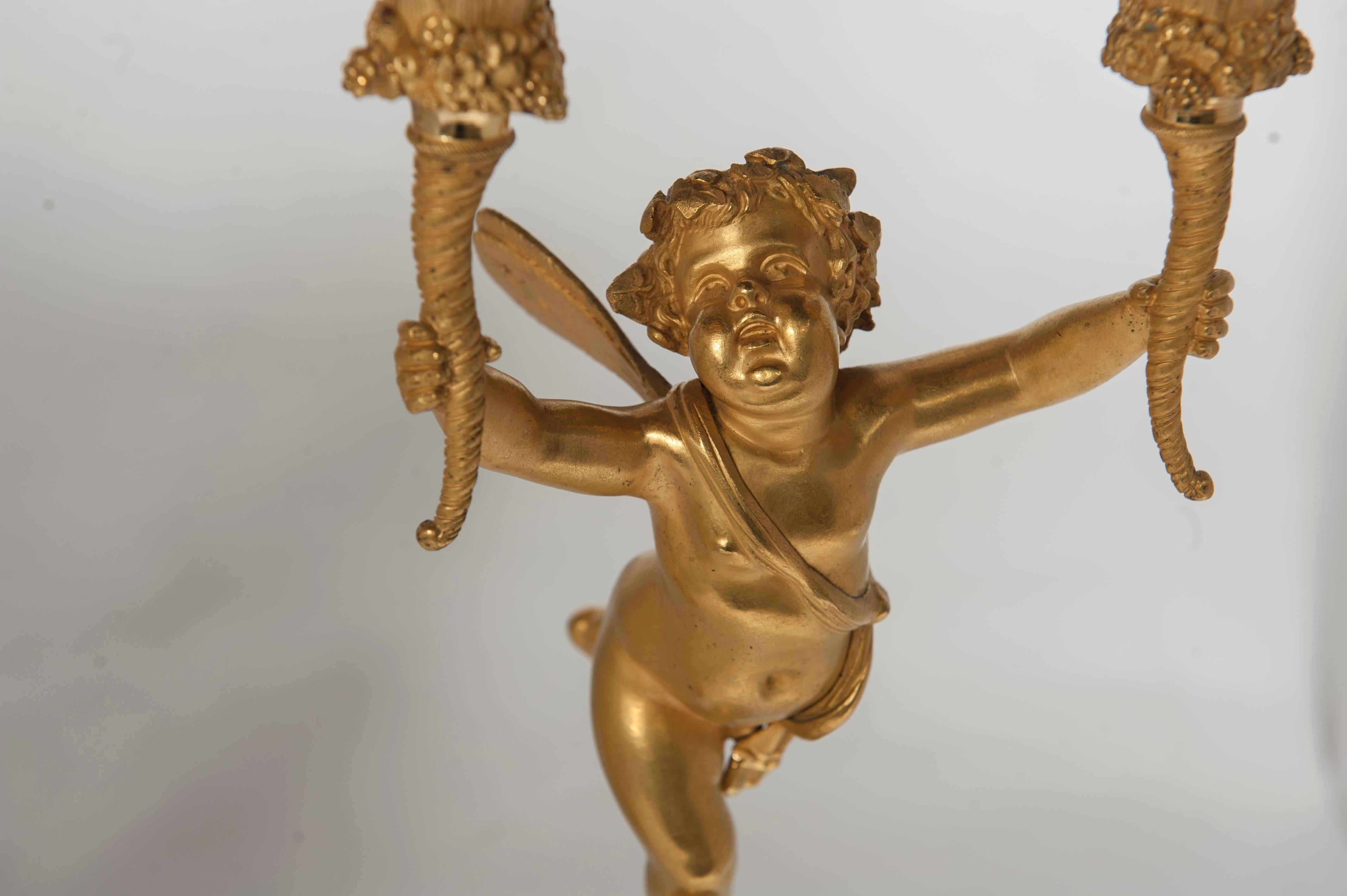 19th Century Pair of Two-Armed Empire Ormolu Candlestick with Cupids, circa 1820 For Sale