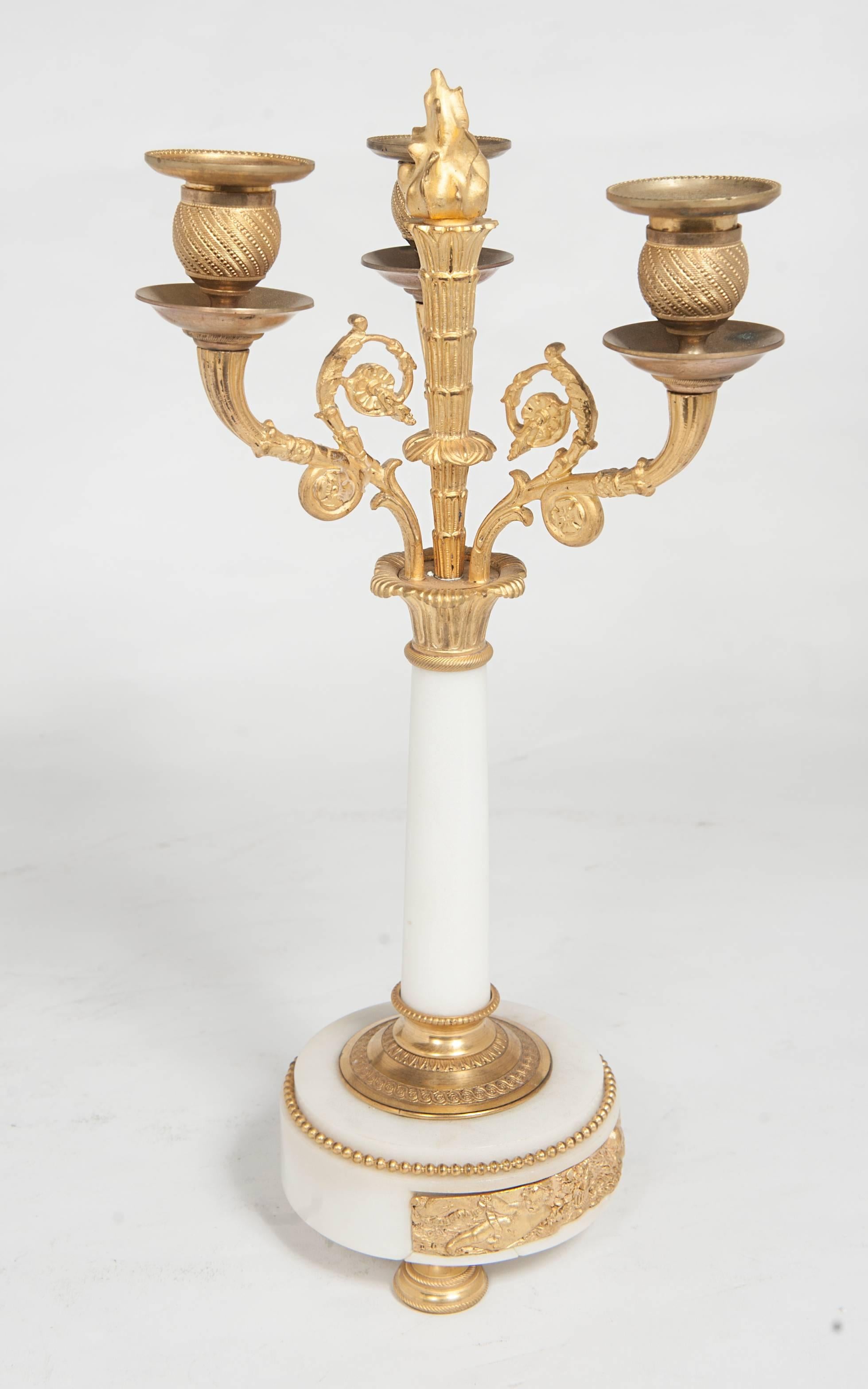 A nice pair of decorative 19th century Louis XVI inspired candlesticks, circa 1860.
The ormolu bronze and white marble is very Classic for this period.
