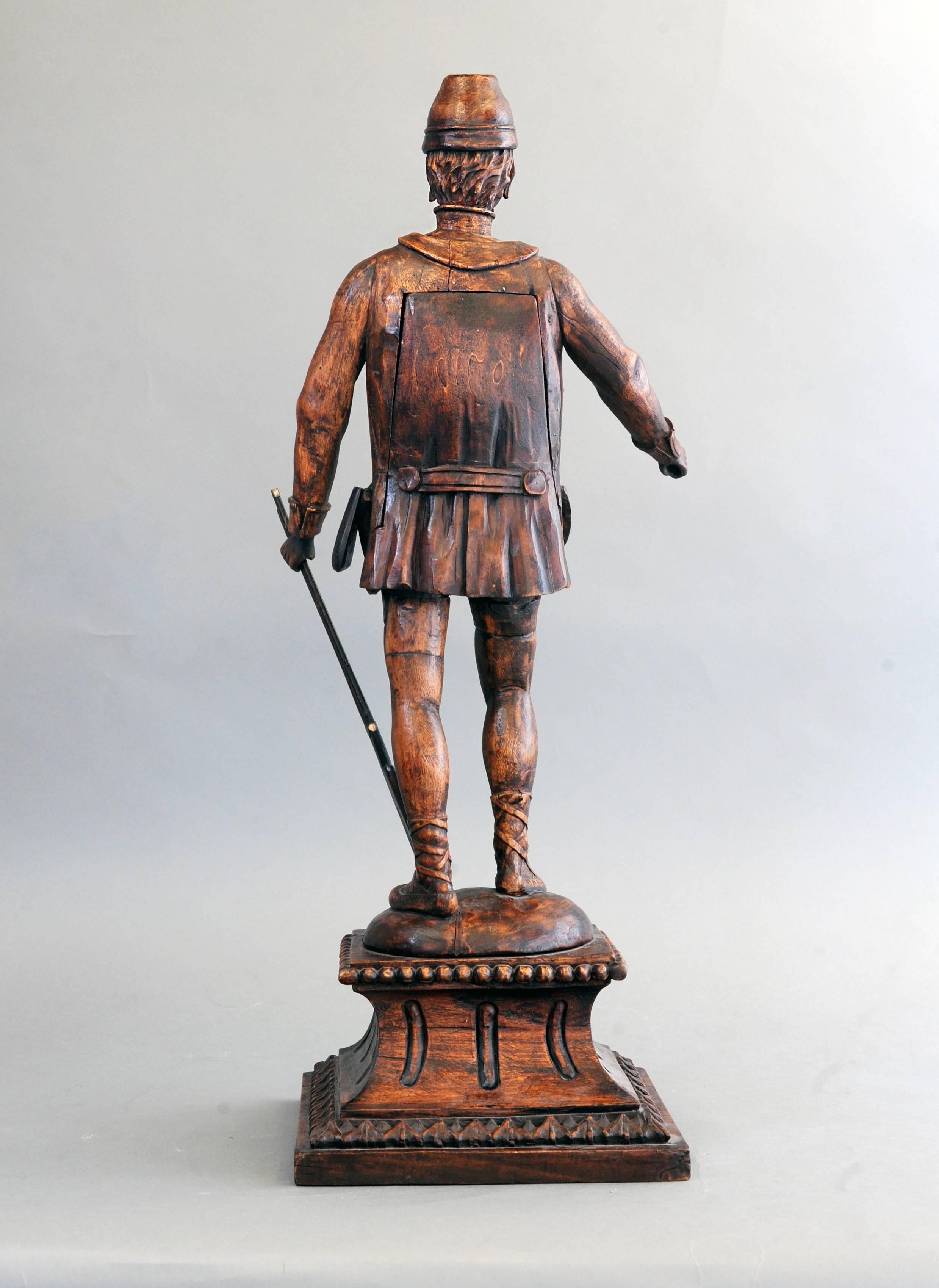 An imposing untouched central Europe soldier figure, circa 1780, signed Jozef Otoo Neutra. The unusual designed figure with hexagonal movement has quarter striking on bells and silk thread suspension. The soldier is fully equipped, lovely carved and
