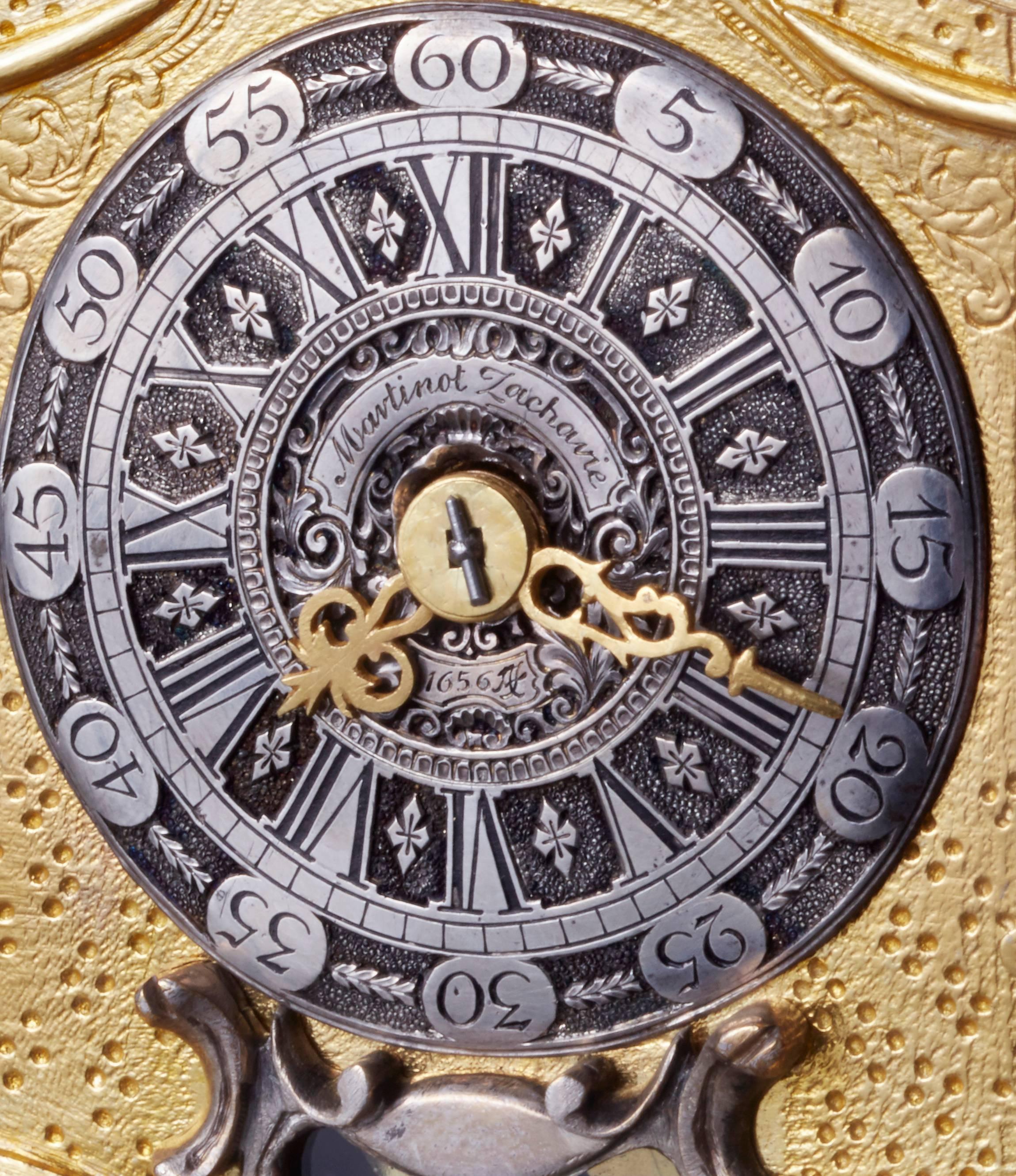 A good late Renaissance ormolu miniature turmuhr Martinot Zachavie, Berlin. The beautiful silver champlive dial with nicely pierced hands, the hour striking and repeating movement with alarm and visible pendulum. The nice fire gilt detailed case