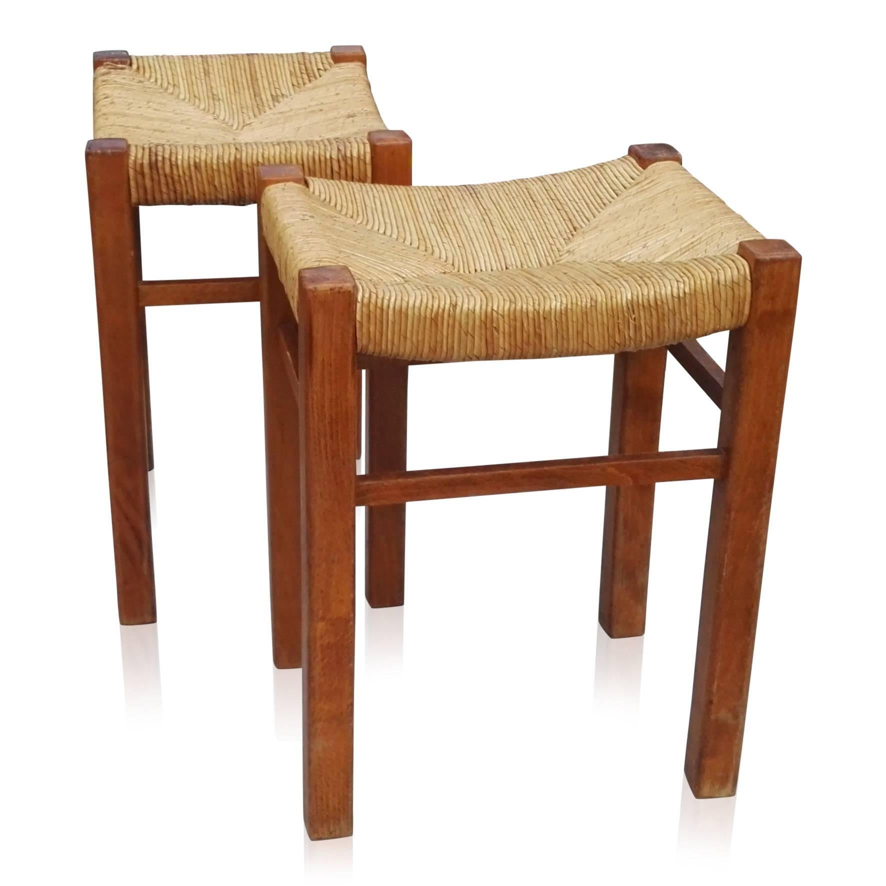 Beechwood and rush stools by Charlotte Perriand's student Gautier-Delaye.
Wear consistent with age.
Good vintage condition.
Editions week end.