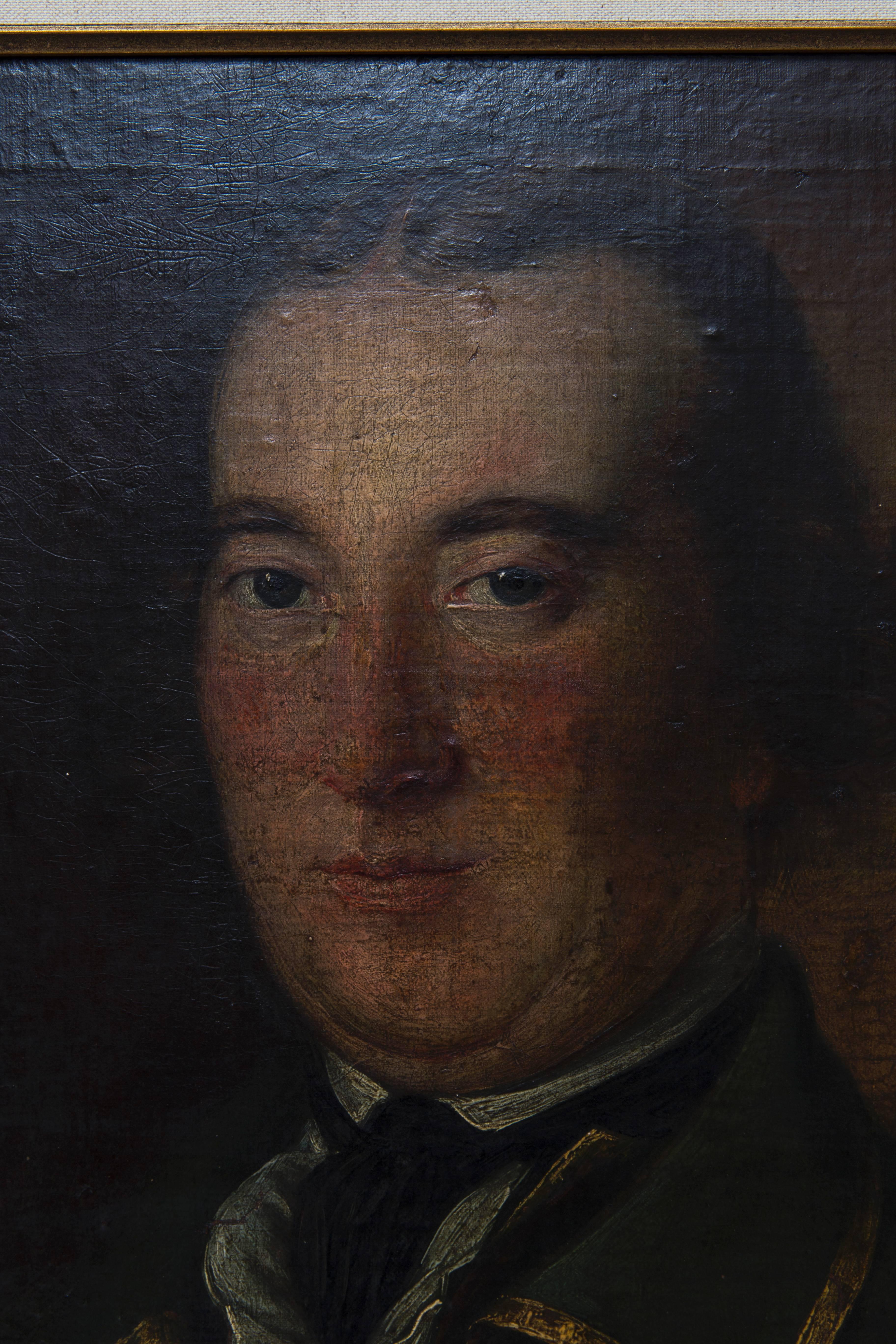 This 19th Century Portrait of an English gentleman has distinct facial features, despite the painting's unknown creator. He is wearing a green military jacket with gold brocade detail. 