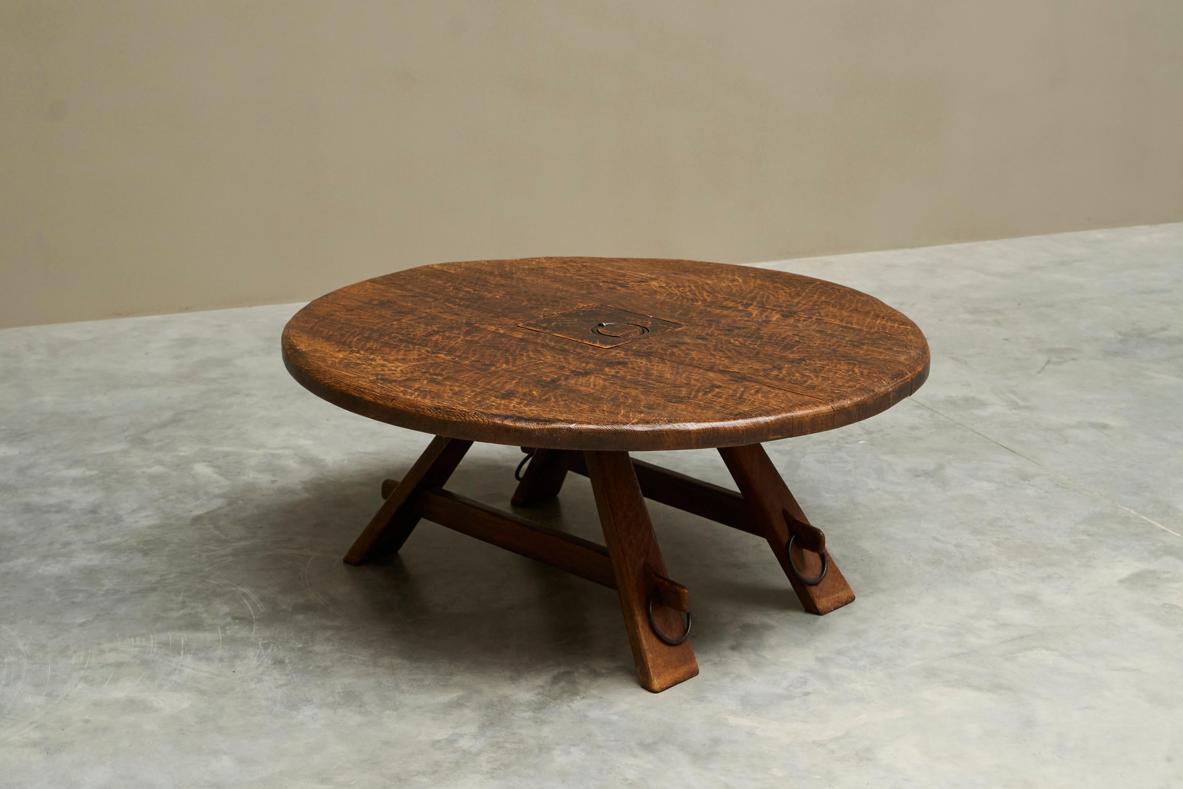 Coffee Table in Solid Oak and Wrought Iron Mid 20th Century

A mid century coffee table in solid oak with details in wrought iron. Belgium or The Netherlands, mid 20th century. 

Low round coffee table in solid oak with a rich, expressive grain. The
