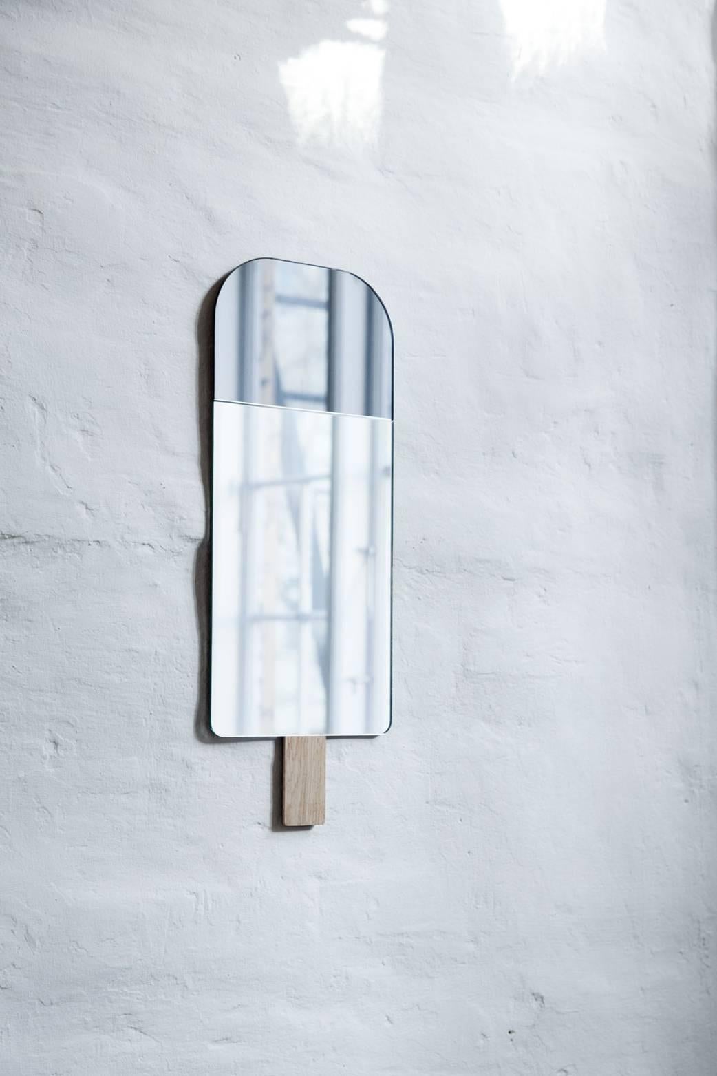 Ice cream mirror in smoked grey by Tor and Nicole Vitner Servé

Designed by Tor + Nicole Vitner Servé
Contemporary, Denmark, 2015
Smoked Grey and mirror glass, European oak
Measures: H 22 in, W 8.5 in

Also available in Ocean Blue, Hazel Brown,