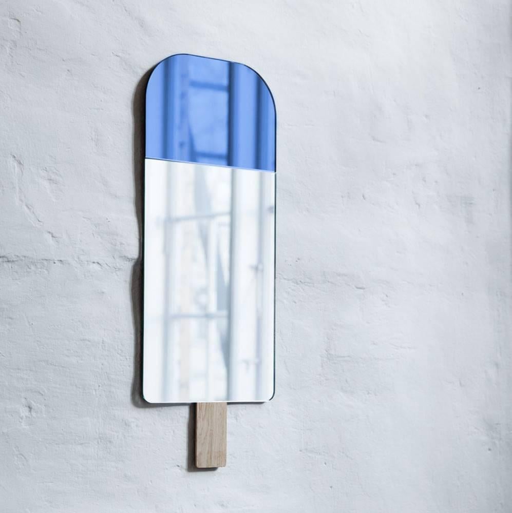 Ice cream mirror in Ocean Blue by Tor and Nicole Vitner Servé

Designed by Tor + Nicole Vitner Serve?
Contemporary, Denmark, 2015
Ocean Blue and mirror glass, European oak
Measures: H 22 in, W 8.5 in

Also available in Exotic Green, Hazel Brown,