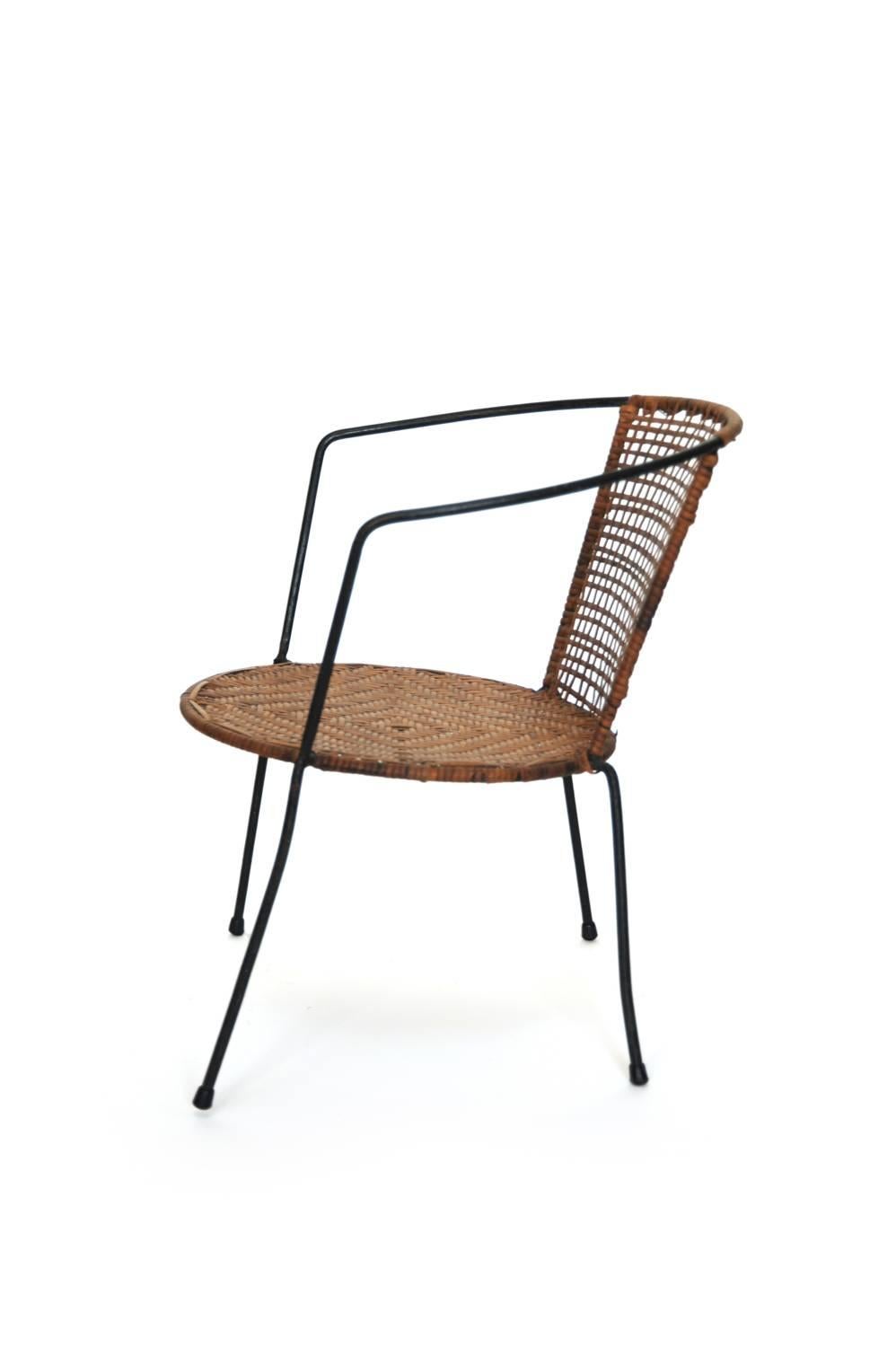 Curved Geometric Rattan Child Chair with Iron Legs, USA, 1950s

Vintage, USA, 1950s
Rattan and Iron
H 17 in, W 16.25 in, D 12 in (seat: H 9.25 in)

From a private child chair collection