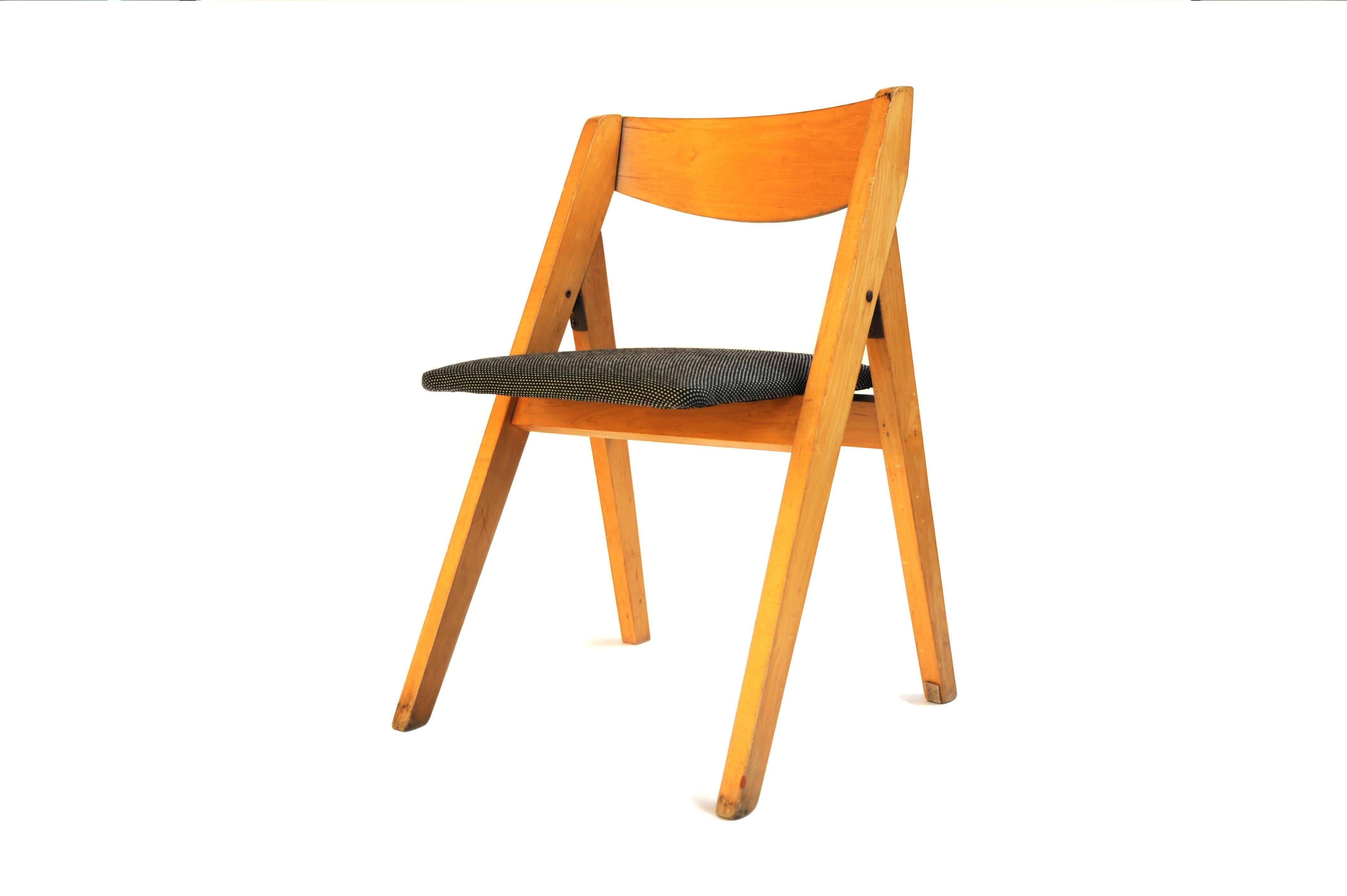 Folding Child Chair in Wood with Seat in New White or Black Maharam Fabric

1960s
Wood, upholstered seat
Recovered in contemporary Maharam fabric
H 22.5 in, W 14.5 in, D 14 in.
Priced individually
Six chairs available: 5 white, 1 black