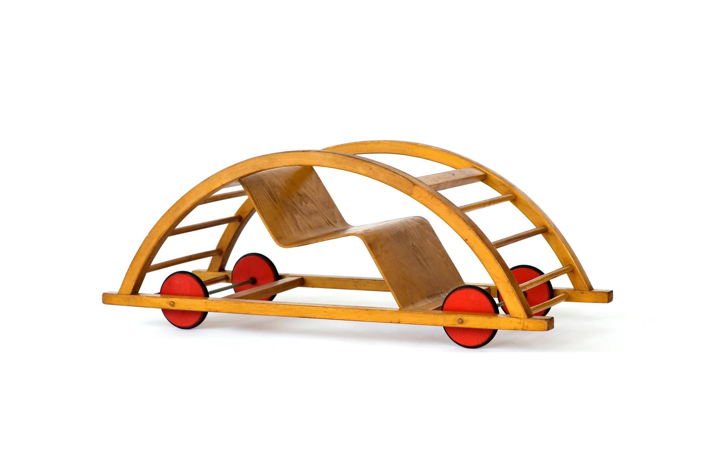 Schaukelwagon child's car or rocker by Hans Brockhage & Erwin Andra, circa 1950.

Designed by Hans Brockhage & Erwin Andra,
Germany, circa 1950.

Flips from a child's car to a rocker. 
Great for up to 6 years old depending on size of child.