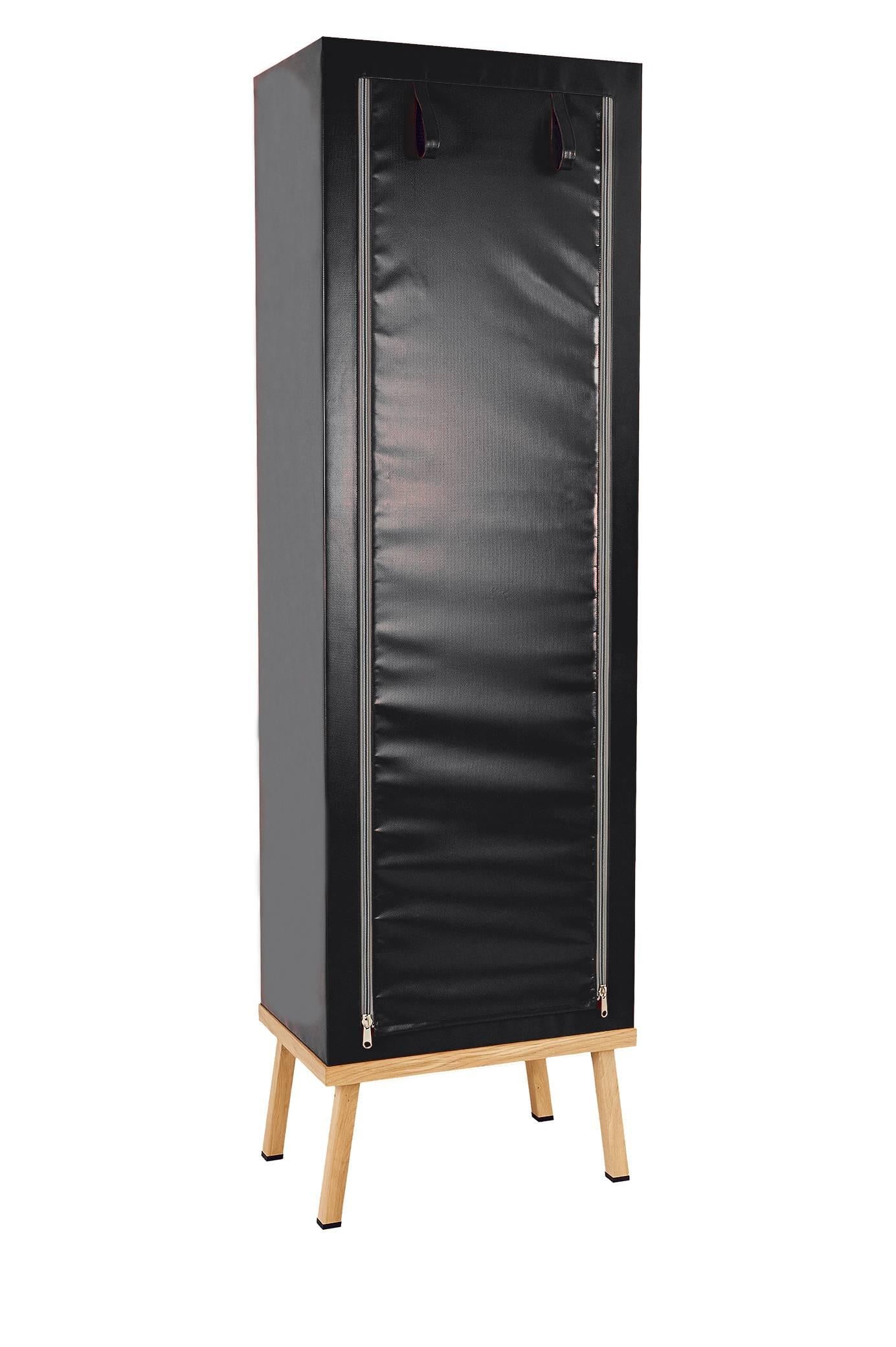 Visser and Meijwaard Truecolors cabinet in black PVC cloth with zipper opening

Designed by Visser en Meijwaard 
Contemporary, Netherlands, 2015
PVC cloth, oakwood, rubber
Measures: H 78.75 in, W 23.75 in, D 15.75 in 

Lead time 8-10 weeks.