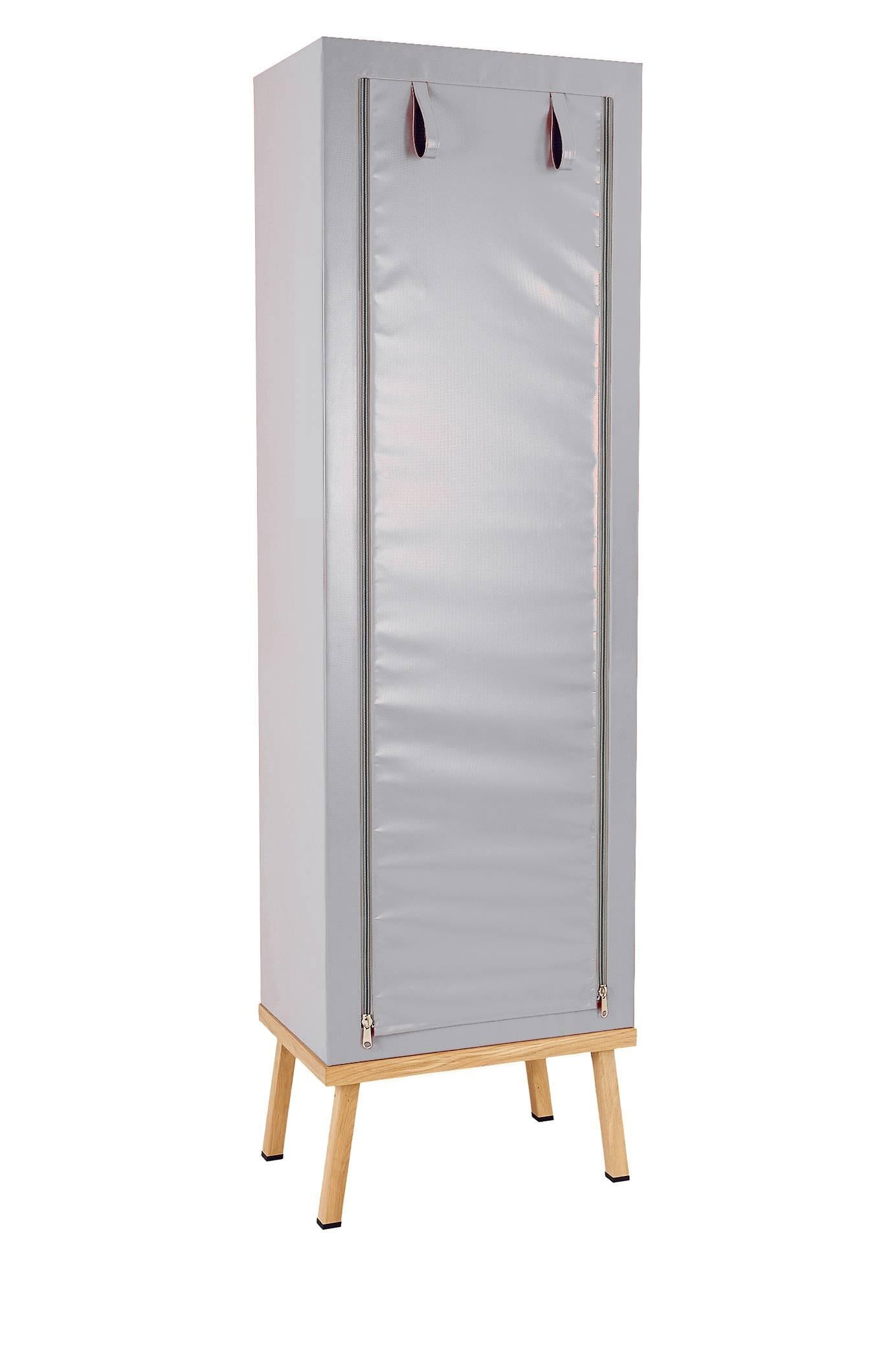 Visser and Meijwaard Truecolors cabinet in grey PVC cloth with zipper opening

Designed by Visser en Meijwaard 
Contemporary, Netherlands, 2015
PVC cloth, oakwood, rubber
Measures: H 78.75 in, W 23.75 in, D 15.75 in 

Lead time 8-10 weeks.