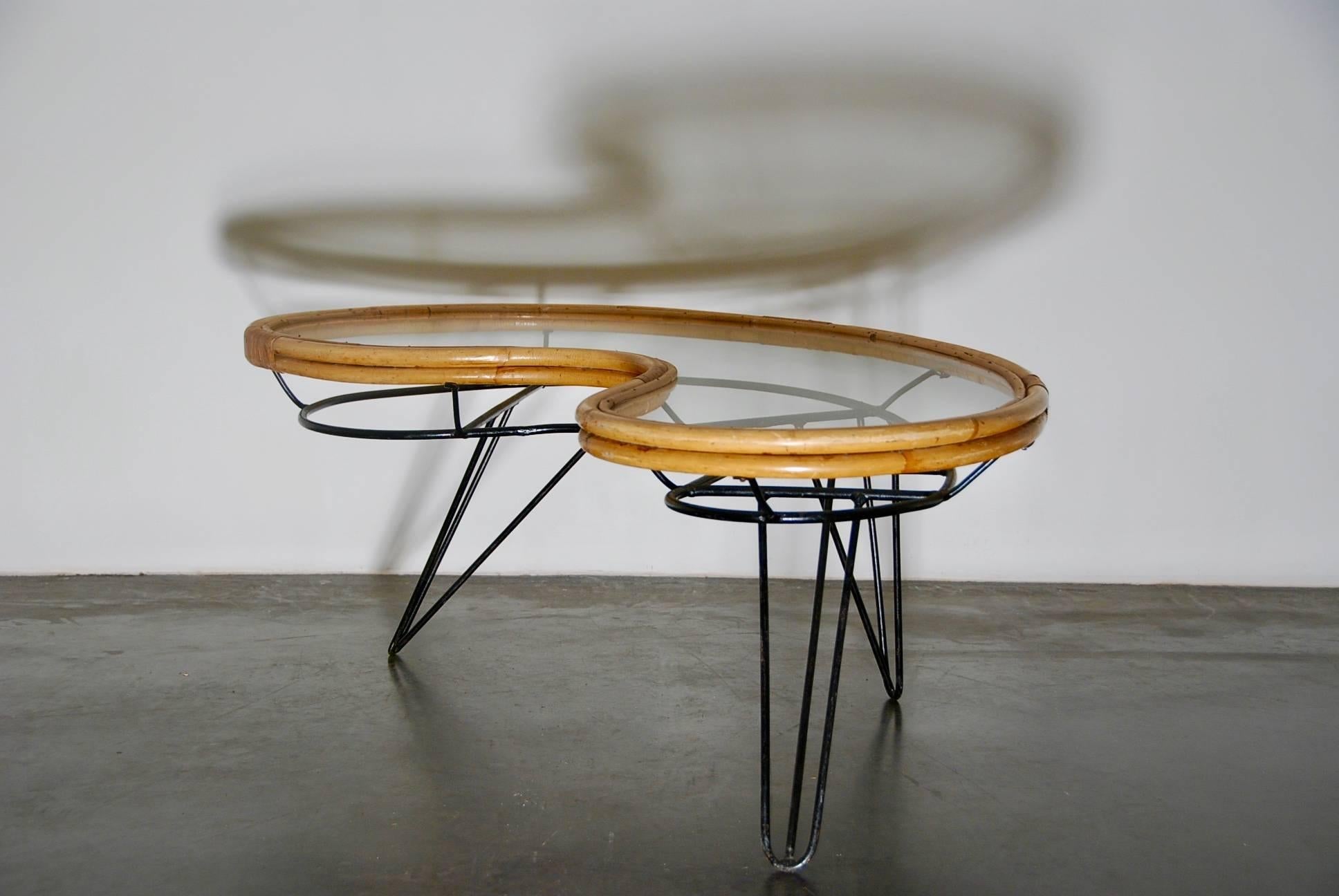 Coffee table designed by Dirk van Sliedrecht, Netherlands, 1950s.
Metal frame, glass tabletop with rattan finition.