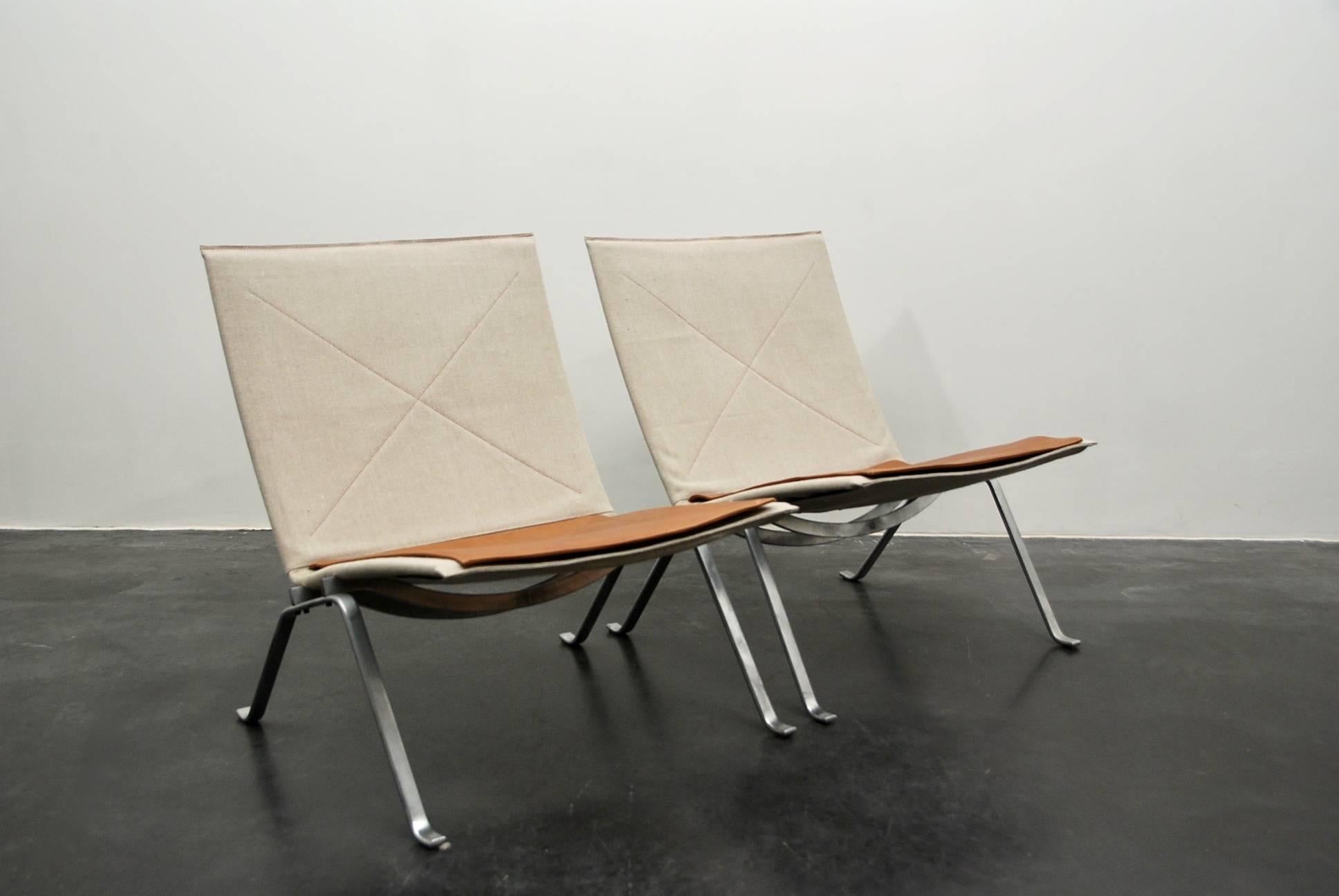 Poul Kjærholm PK22 lounge chair for E. Kold Christensen, first edition, Denmark, 1956. Dull chromium-plated steel, new hand upholstered in canvas with leather deep cognac color flat seat cushion.