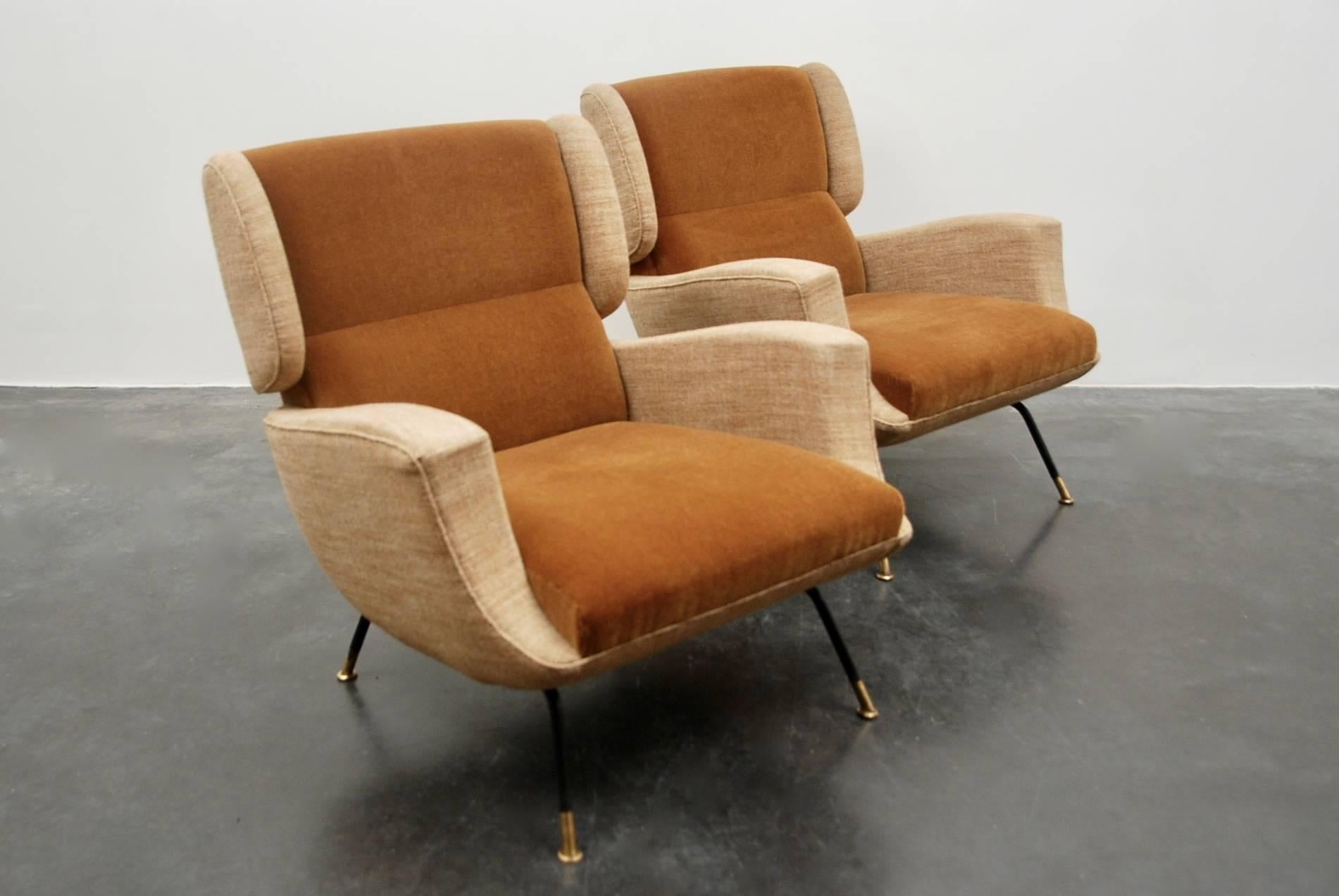Italian manufacturing for these 1950s armchairs, New upholstered with very nice quality of velvet and wool, very nice finitishing for the feet in copper . 
Pair of Armchairs extremely decorative and elegant.