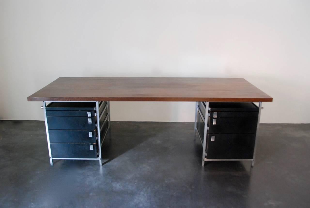 Very nice quality of desk designed by designer Jules Wabbes, Belgium, 1950s.
Solid wengé strips on chromium-plated steel pedestals, chromium plated handles, all original condition.