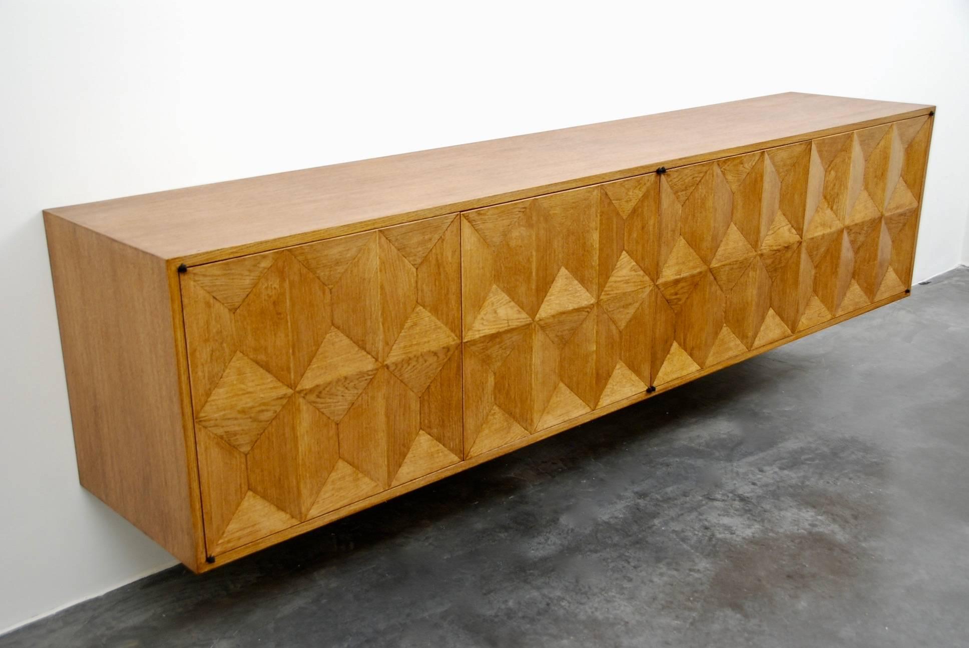 Brutalist wall-mounted four-door buffet produced by De Coene with diamond oak designed front panels, Belgium, 1960s.