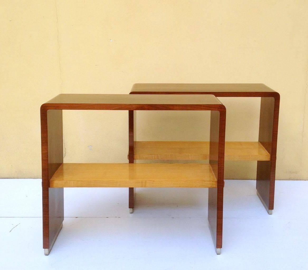 Elegant pair of side/bedside tables in maple, mahogany and metal.
These tables are an example of the rationalist design of the early 1930s.

Many more pieces are stored in our warehouse, so please contact us  to find out the items which aren't