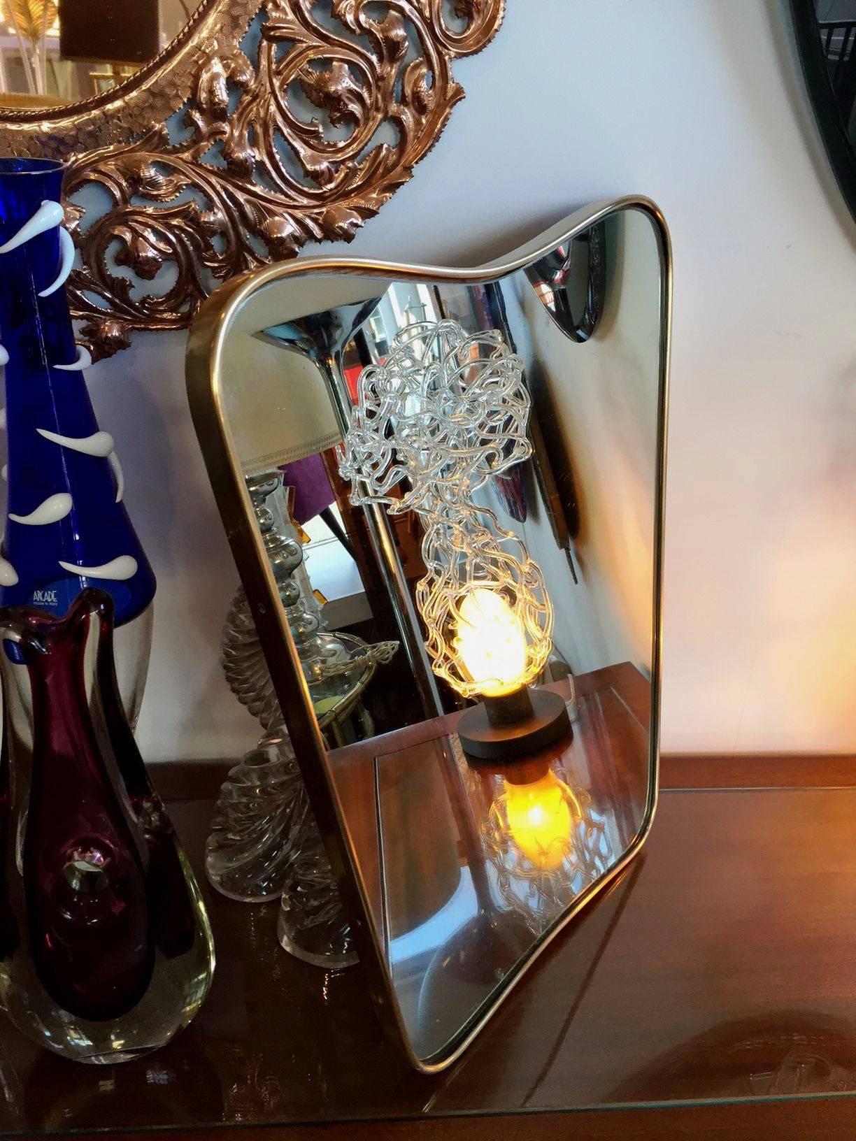 Small but refined free-form Galvanit Fontana mirror in brass, original condition, stamped and dated in the back.