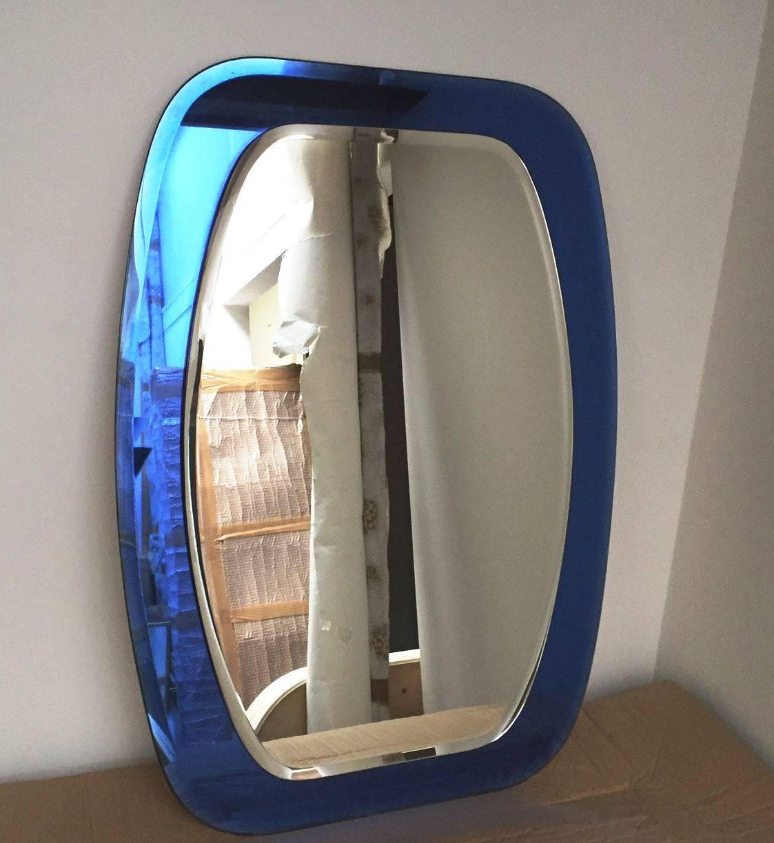 Striking blue 1960s mirror by Cristal-Luxor, perfect original conditions.